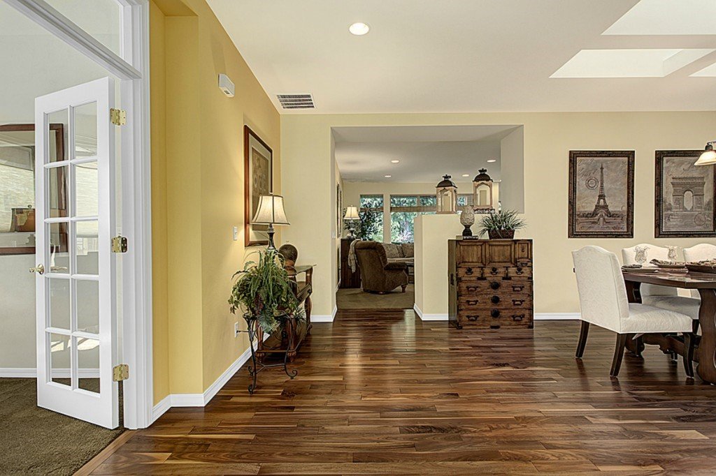 Foyer and formal dining room with hardwood floors in Trilogy Redmond home