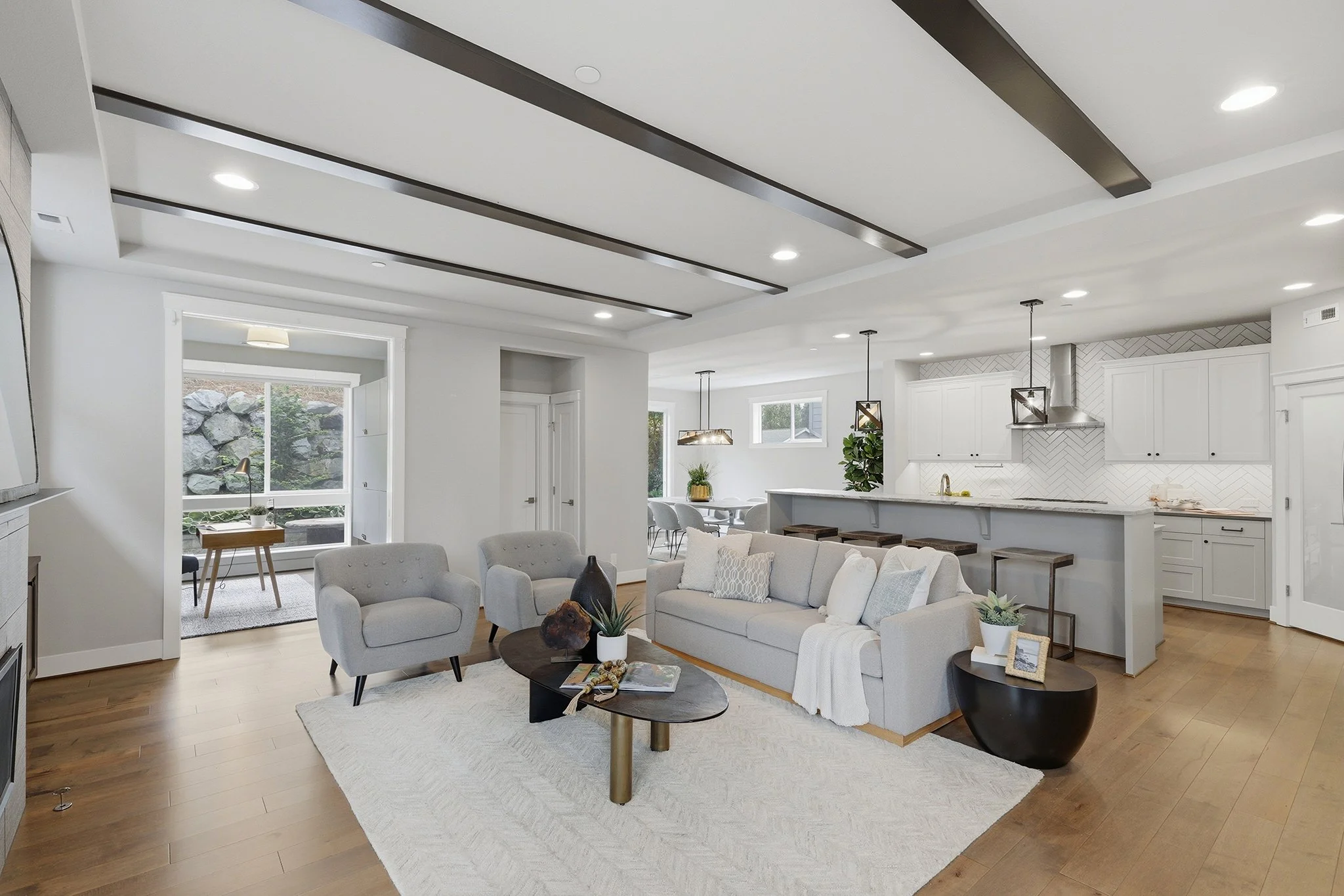 Open-concept living and kitchen area with hardwood floors, Hawthorne Park Redmond home