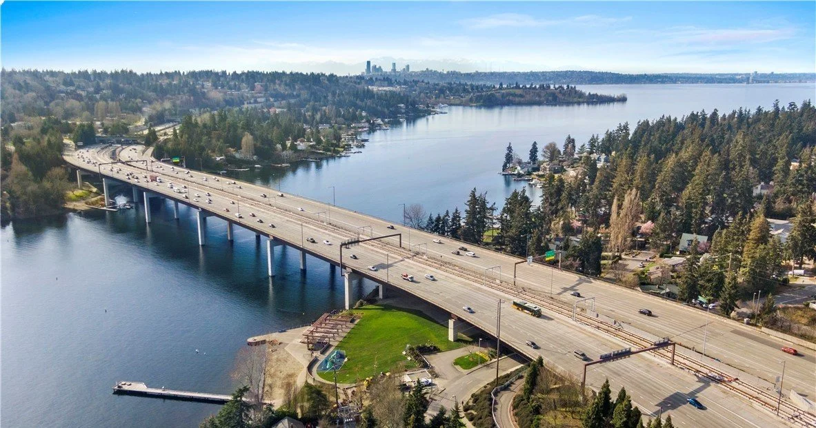 Aerial view of I-90 floating bridge and Enatai Beach Park along the Lake Washington shoreline, Bellevue
