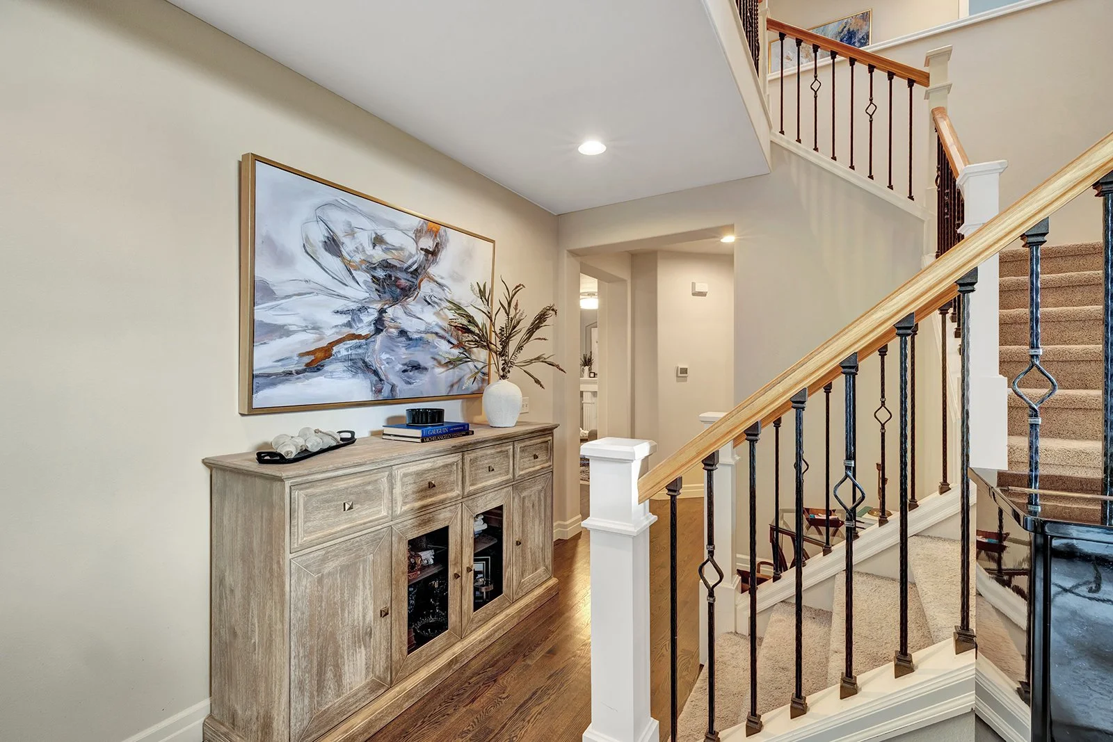 Elegant staircase with hardwood treads and custom railing — two-story entry hall at 3208 175th St SE, Mill Creek Meadows Bothell WA