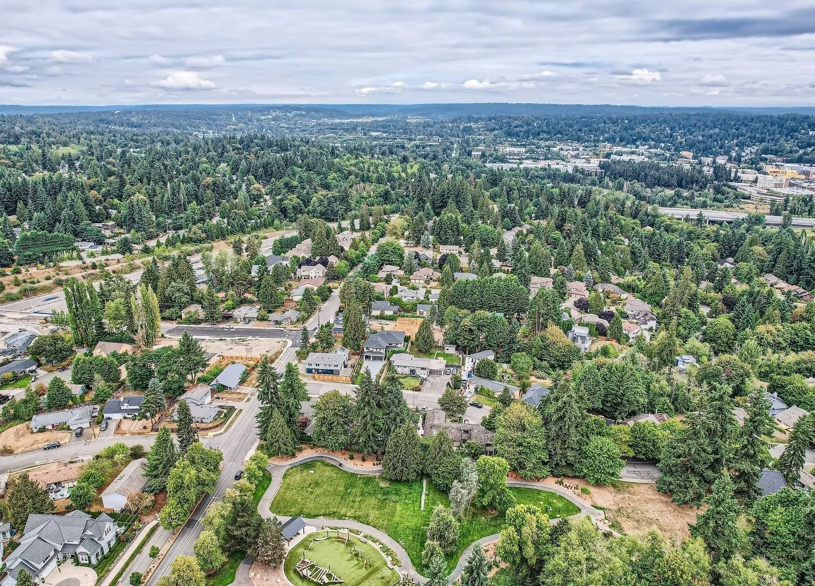 Aerial view of Overlake Redmond single-family neighborhood showing a home under construction