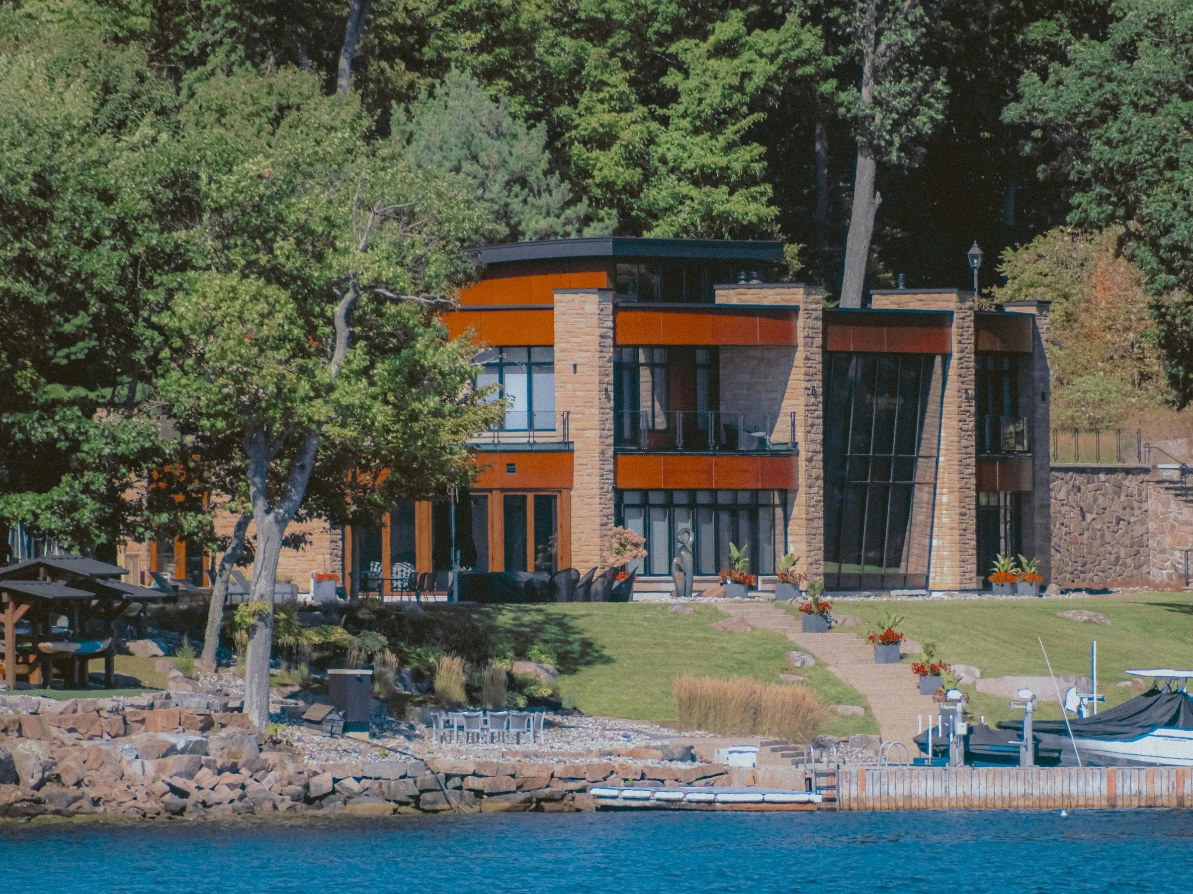 Modern architectural new-construction waterfront home meeting current shoreline setback regulations