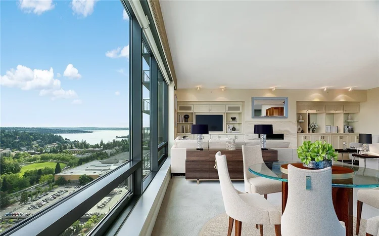 Living and dining room with Lake Washington views at One Lincoln Tower
