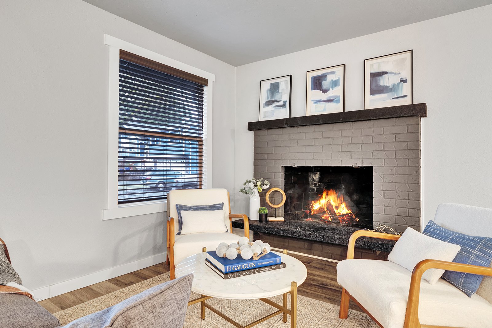 Cozy living area with gas fireplace and built-in skylights in Finn Hill home offering comfortable gathering space for family entertaining