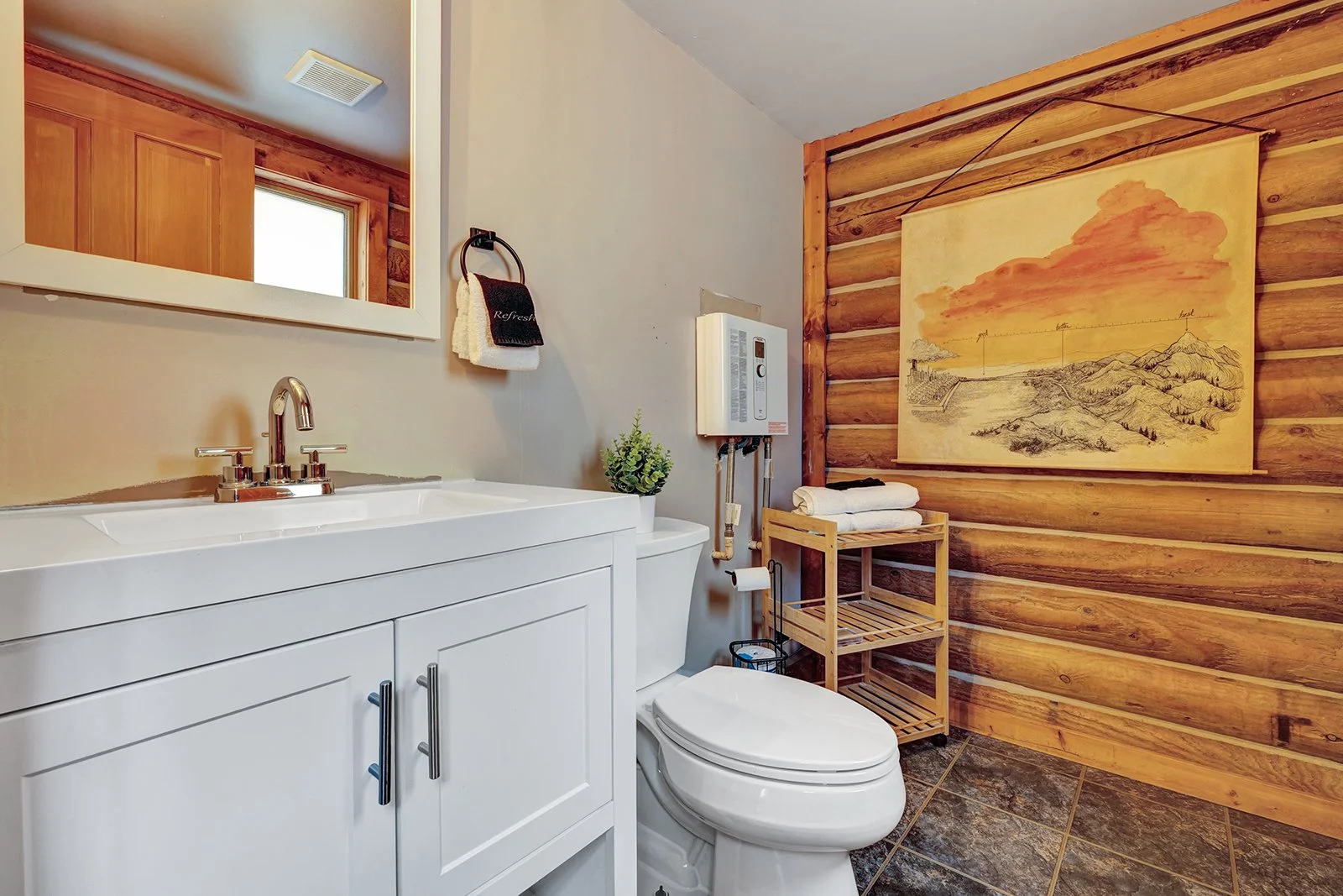 Half bathroom on main floor of Pine Vista log cabin at 17336 Chumstick Hwy Leavenworth WA in clean move-in ready condition