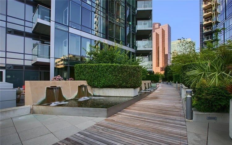 Landscaped courtyard walkway and water feature connecting the North and South towers