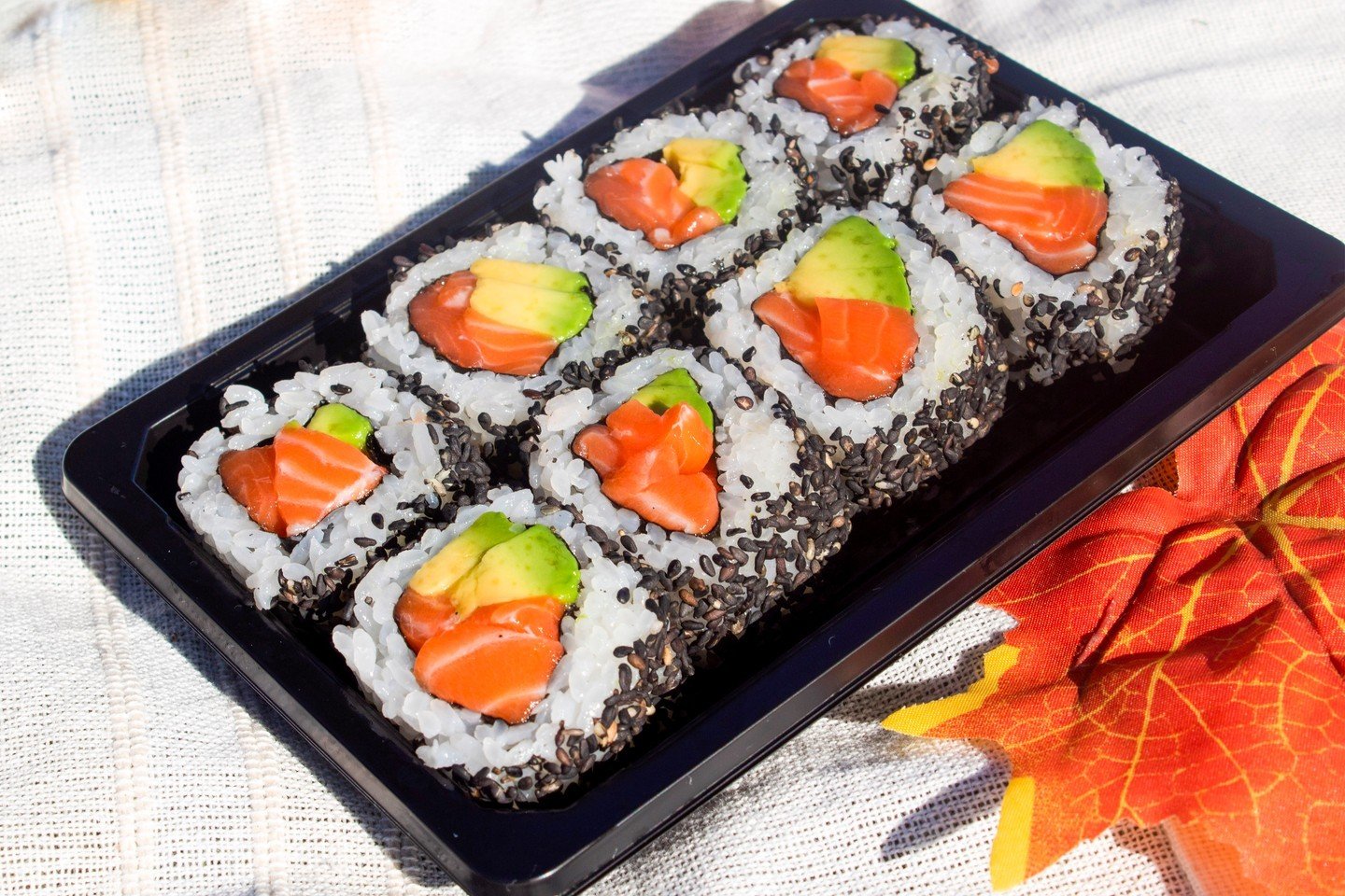Our Avocado &amp; Salmon Roll, coated in black sesame seeds, is a fan favourite! 🥑🍣 Enjoy the perfect combination of creamy avocado, fresh salmon, and a nutty sesame crunch.

Grab yours today at ABURI Market. Available for delivery and pick up via 