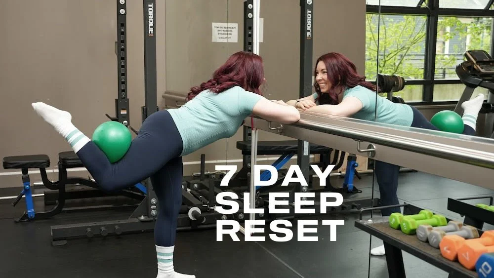 Title card for the 7 Day Sleep Reset. White text "7 Day Sleep Reset" on a background of a woman doing a barre fitness glute extension exercise with a pilates ball.