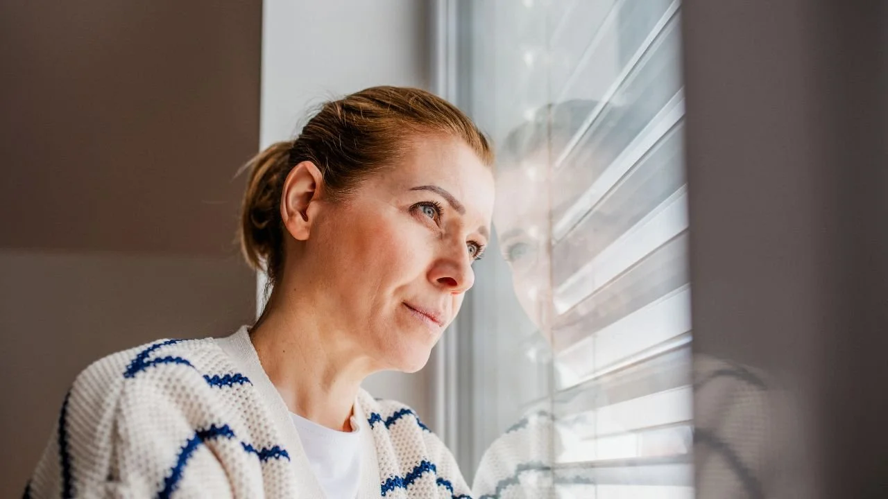 woman in midlife reflecting on her beliefs