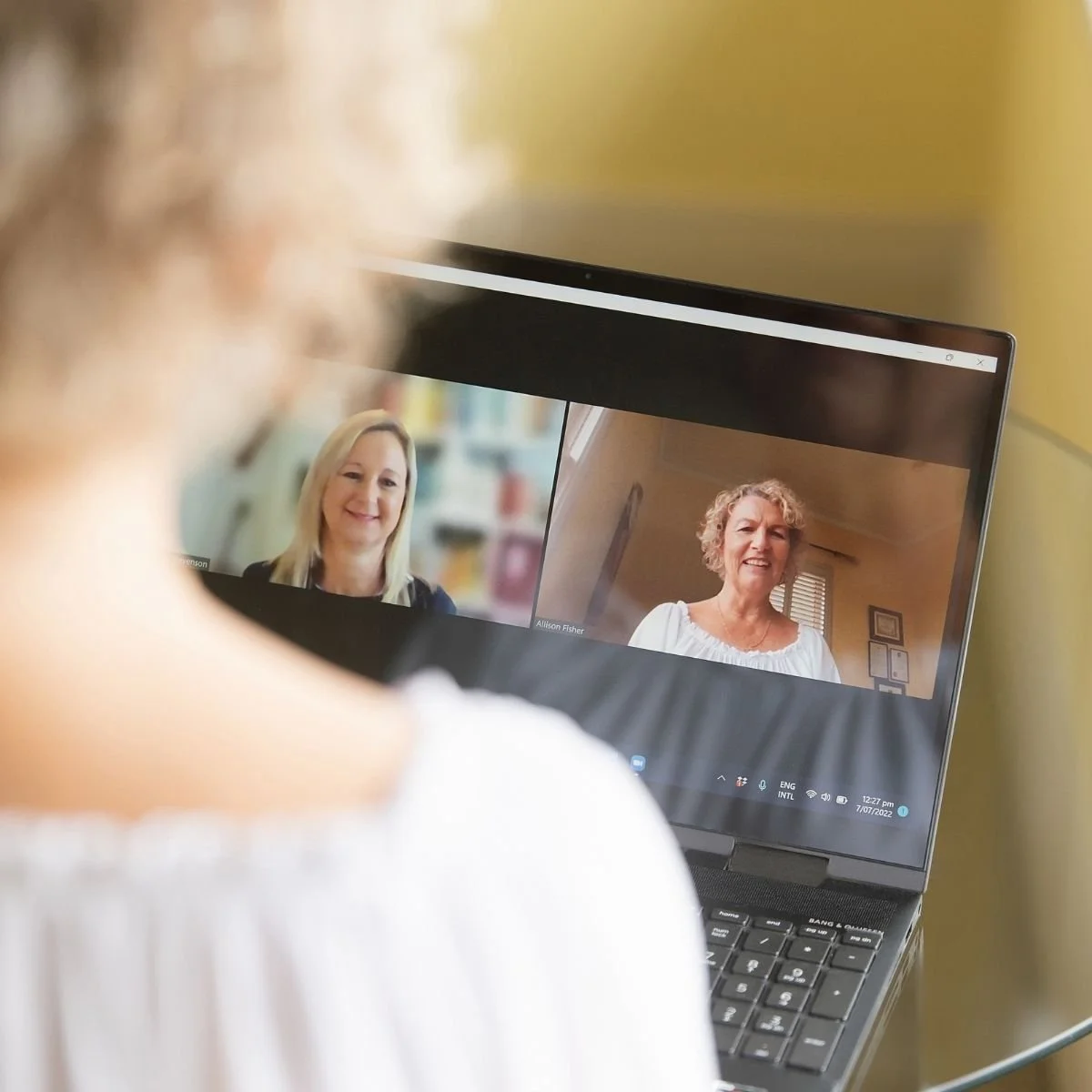 Allison Fisher shown in an online coaching call with a middle aged female coaching client