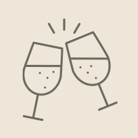 Two champagne glasses clinking together in a celebratory toast with sparkles.