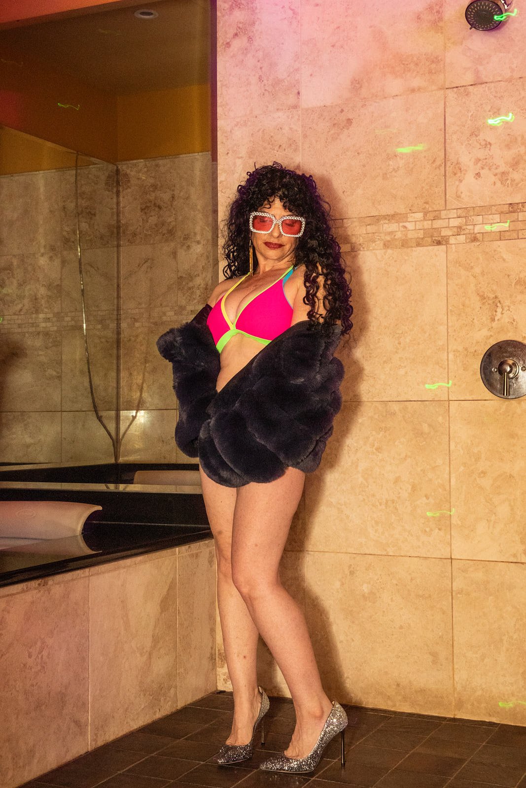 Luxury naughty boudoir experience portrait showcasing the vibrant, colorful atmosphere of the 70's era photoshoot. Photo by Rikki Ward, Juicy Fruit Boudoir - Bay Area.