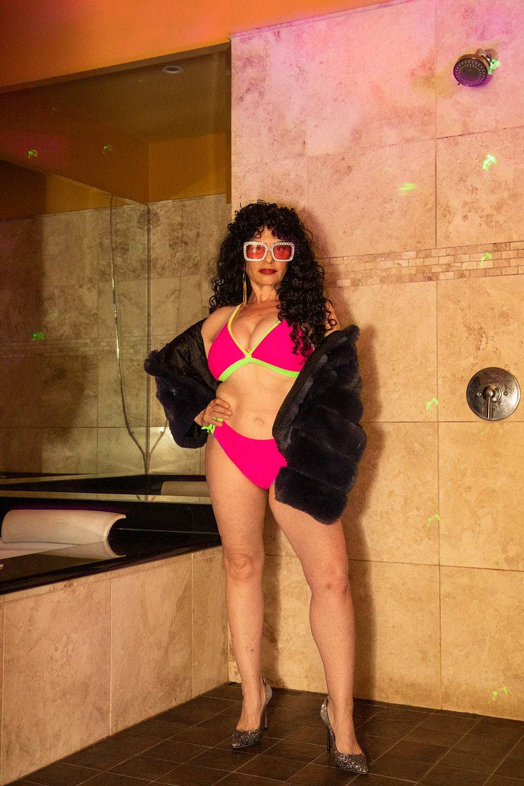 70's style boudoir photoshoot with vibrant colors and retro lighting in Oakland. Photo by Rikki Ward, Juicy Fruit Boudoir - Bay Area.