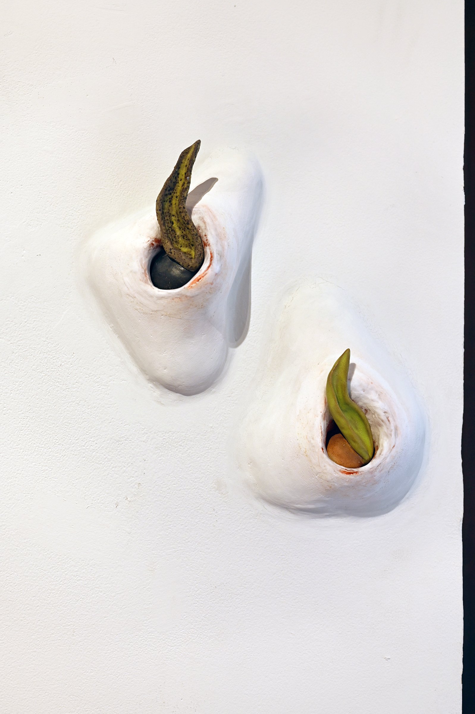  Nicki Cherry “Trepans”, 2021 Each approximately 8" x 5" x 4" Plaster, polystyrene, paint, wax, aromachemicals, paint, glazed ceramic stoneware 