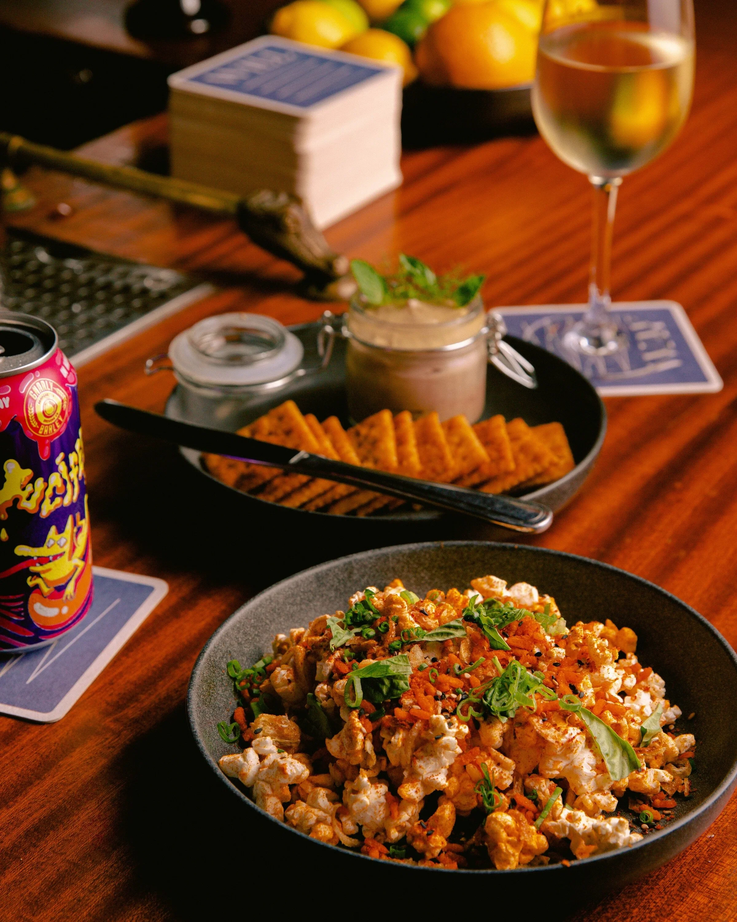 Late night snacks and drinks on a bar counter.