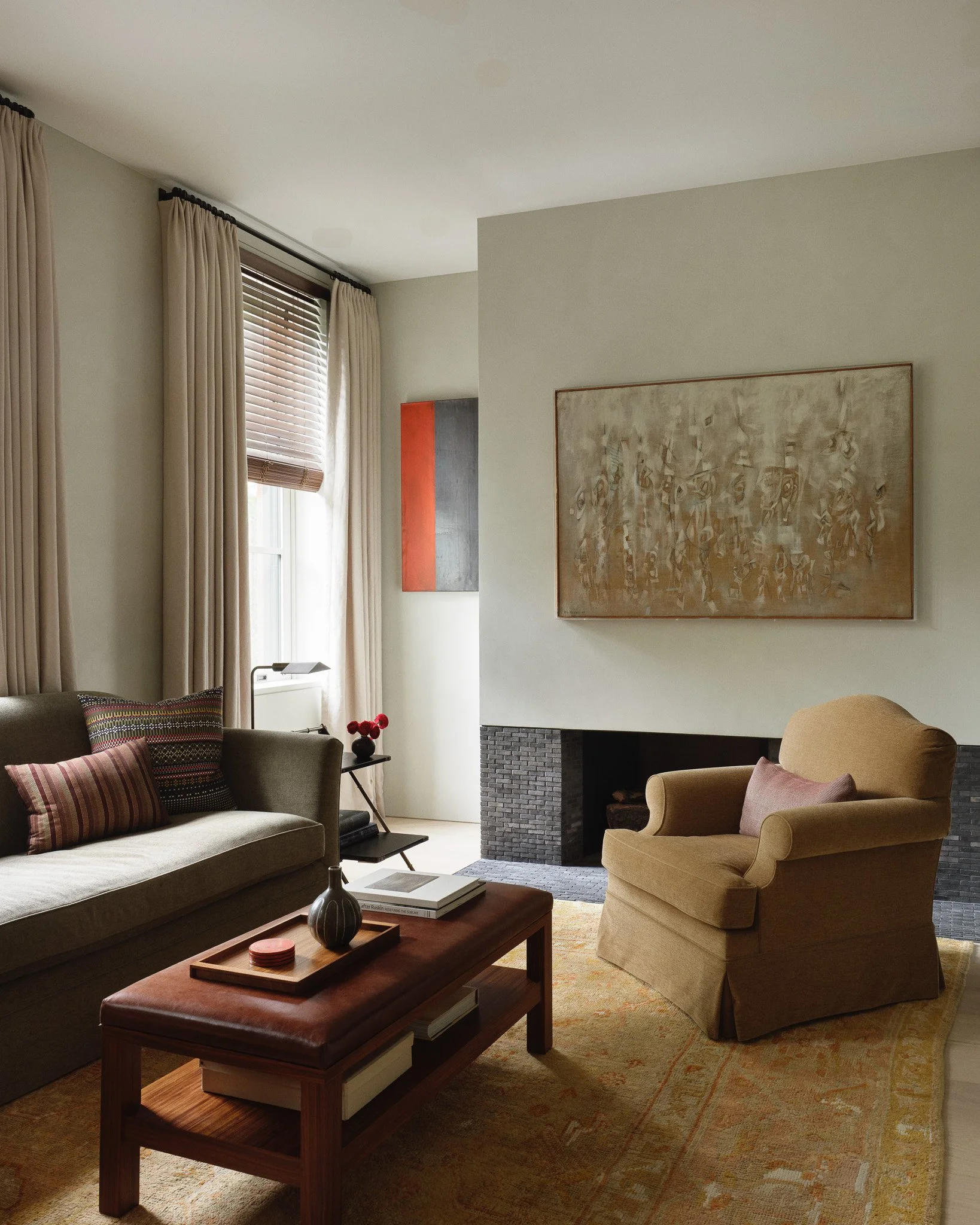 couch and chair seating with wooden coffee table in a West Village townhouse by JG Neukomm Architecture