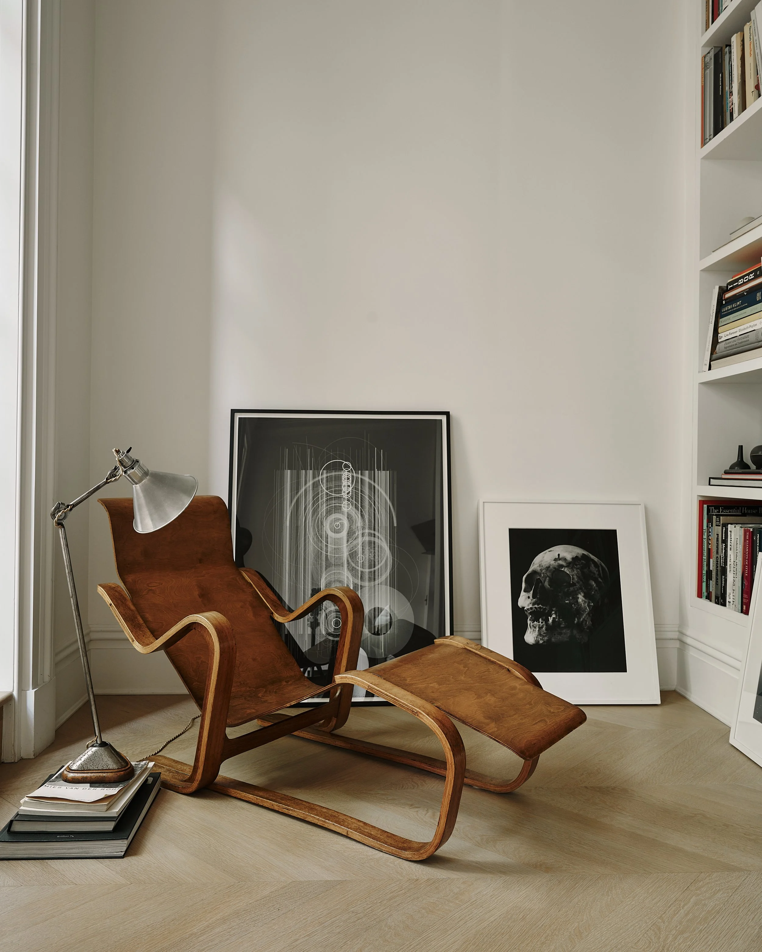 wooden recliner chair in a west village townhouse designed by JGNA