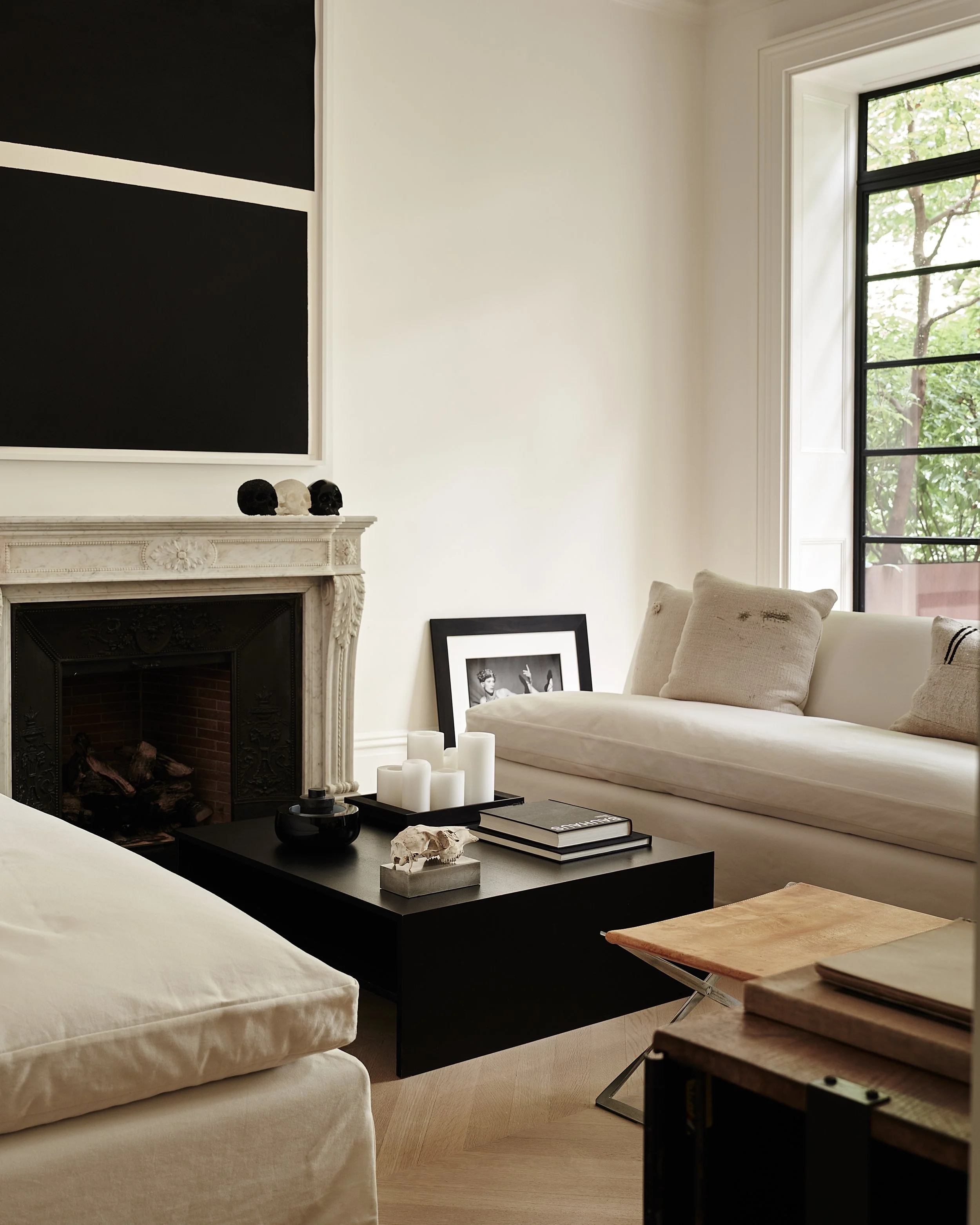 stone fireplace in modern living room in west village townhouse with modern art by JGNA