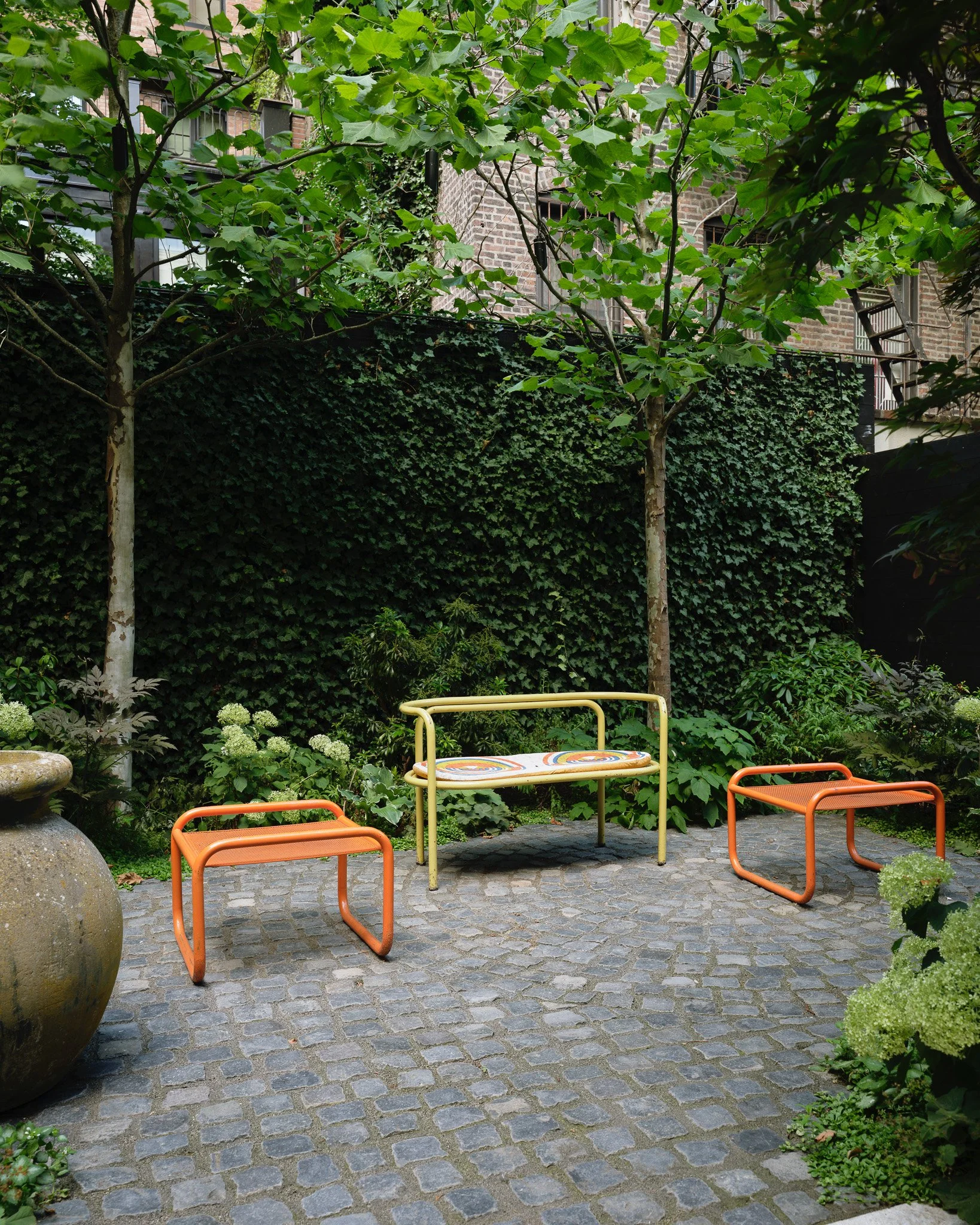 outdoor patio space with seating in a West Village townhouse by JG Neukomm Architecture
