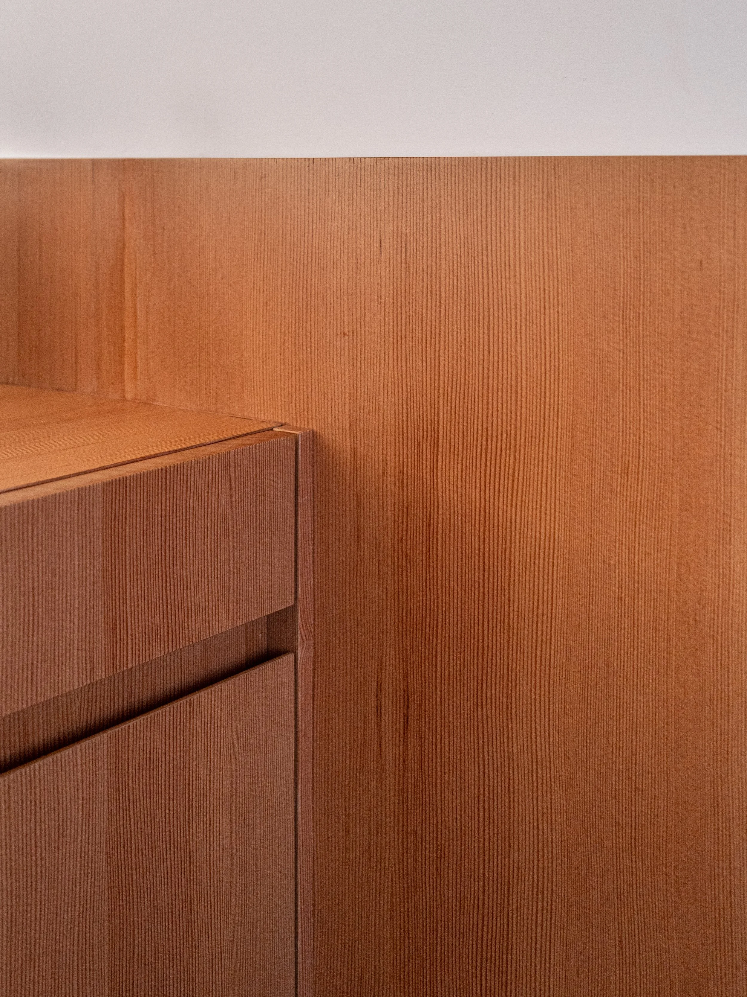 Custom vertical-grain wood millwork and cabinetry detail in a West Village townhouse by JG Neukomm Architecture