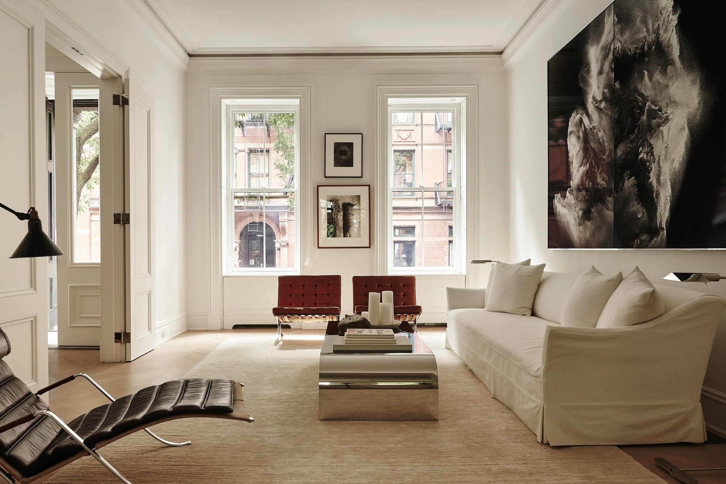 modern luxury living room with variety of seating and natural lighting