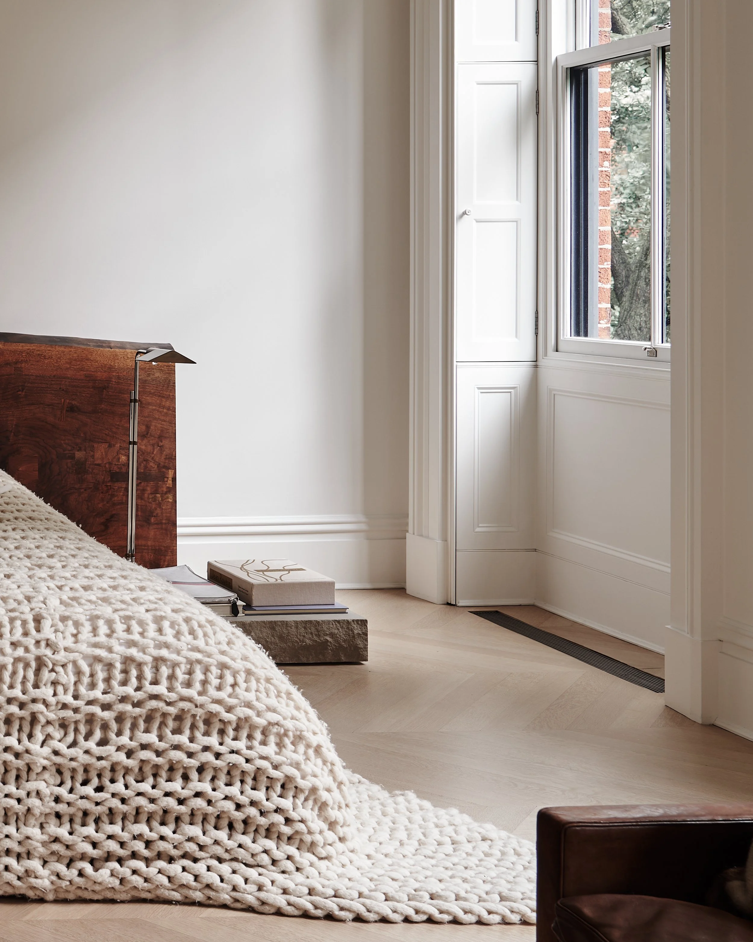 close up view of bedding and headboard  in fabien barons west village townhouse by JGNA
