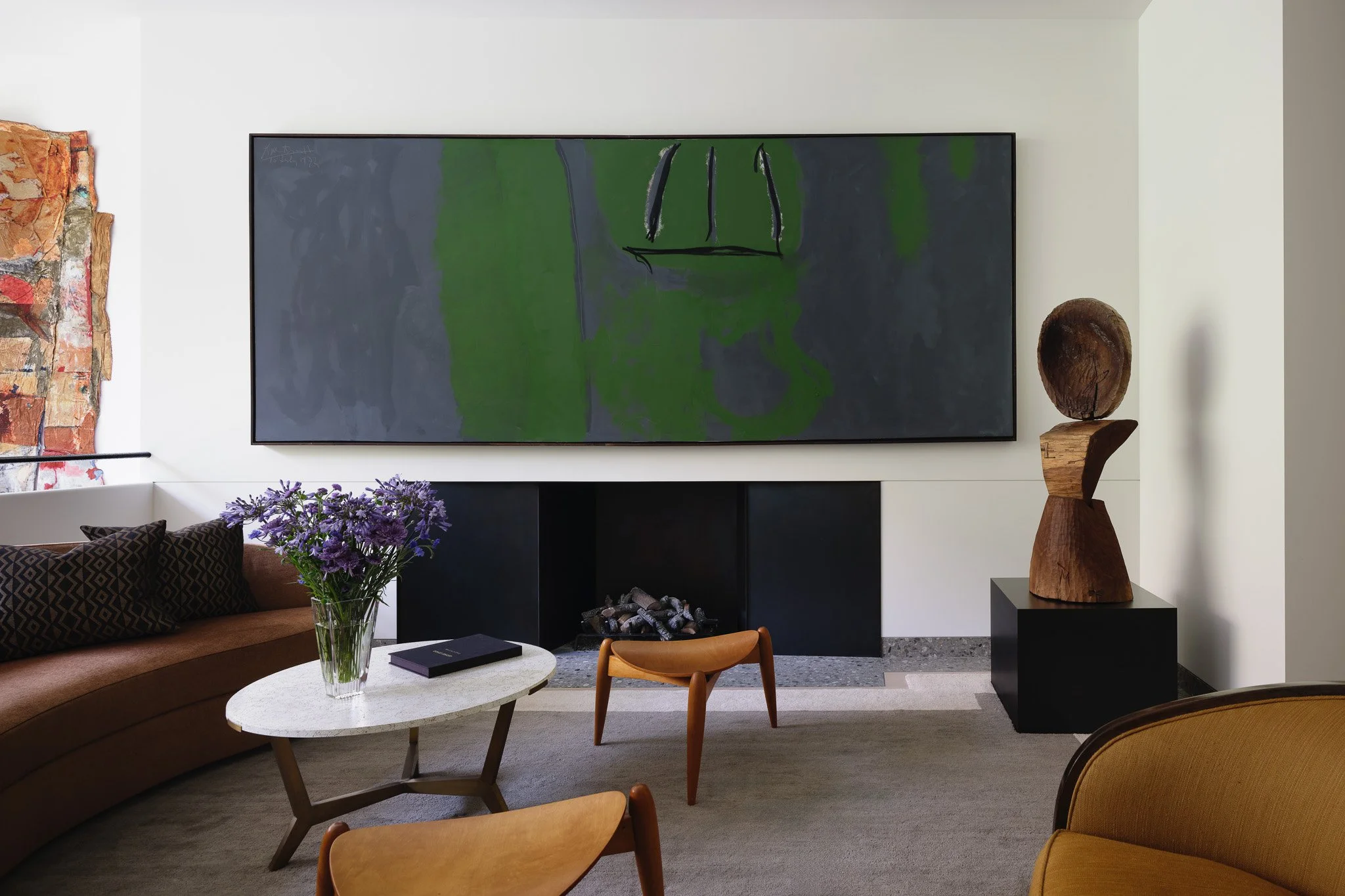 green and gray painting in living space with seating in a West Village townhouse by JG Neukomm Architecture
