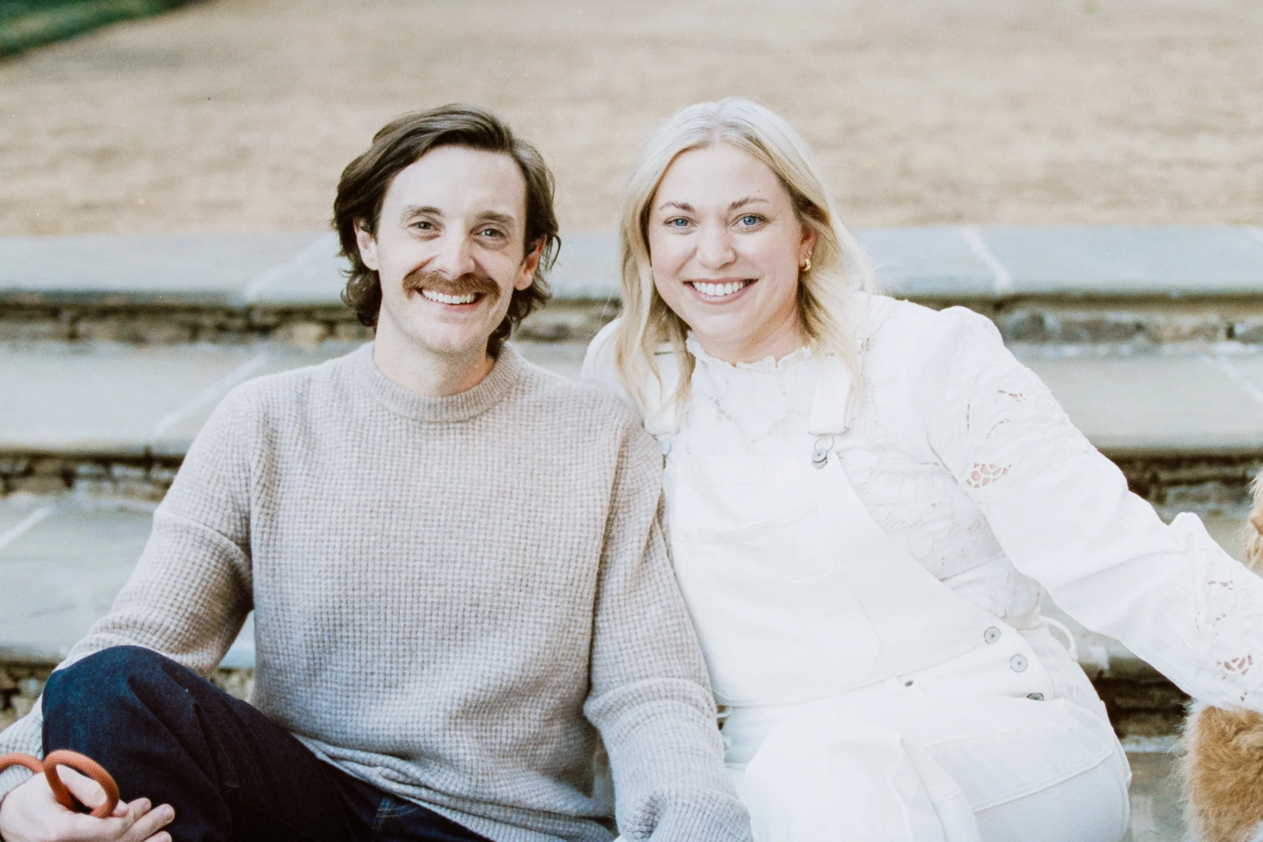 Film Engagement Photos on The Green Uptown Charlotte St Peter Catholic Church by wedding photographer ParksPictures