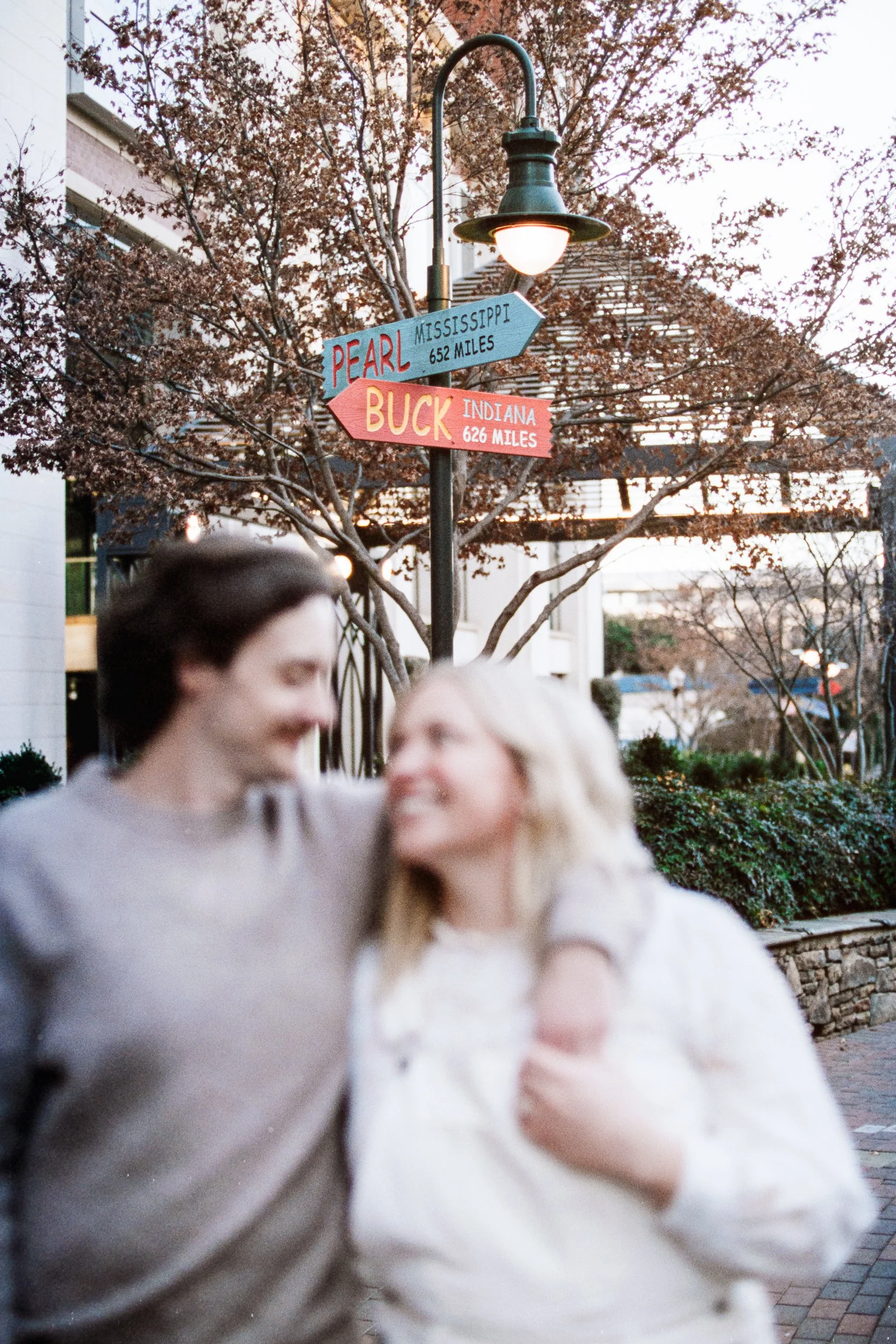 Film Engagement Photos on The Green Uptown Charlotte St Peter Catholic Church by wedding photographer ParksPictures