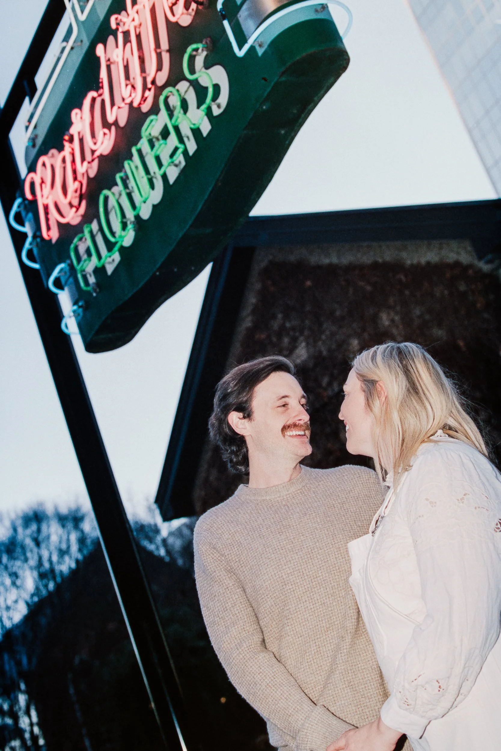Film Engagement Photos on The Green Uptown Charlotte St Peter Catholic Church by wedding photographer ParksPictures