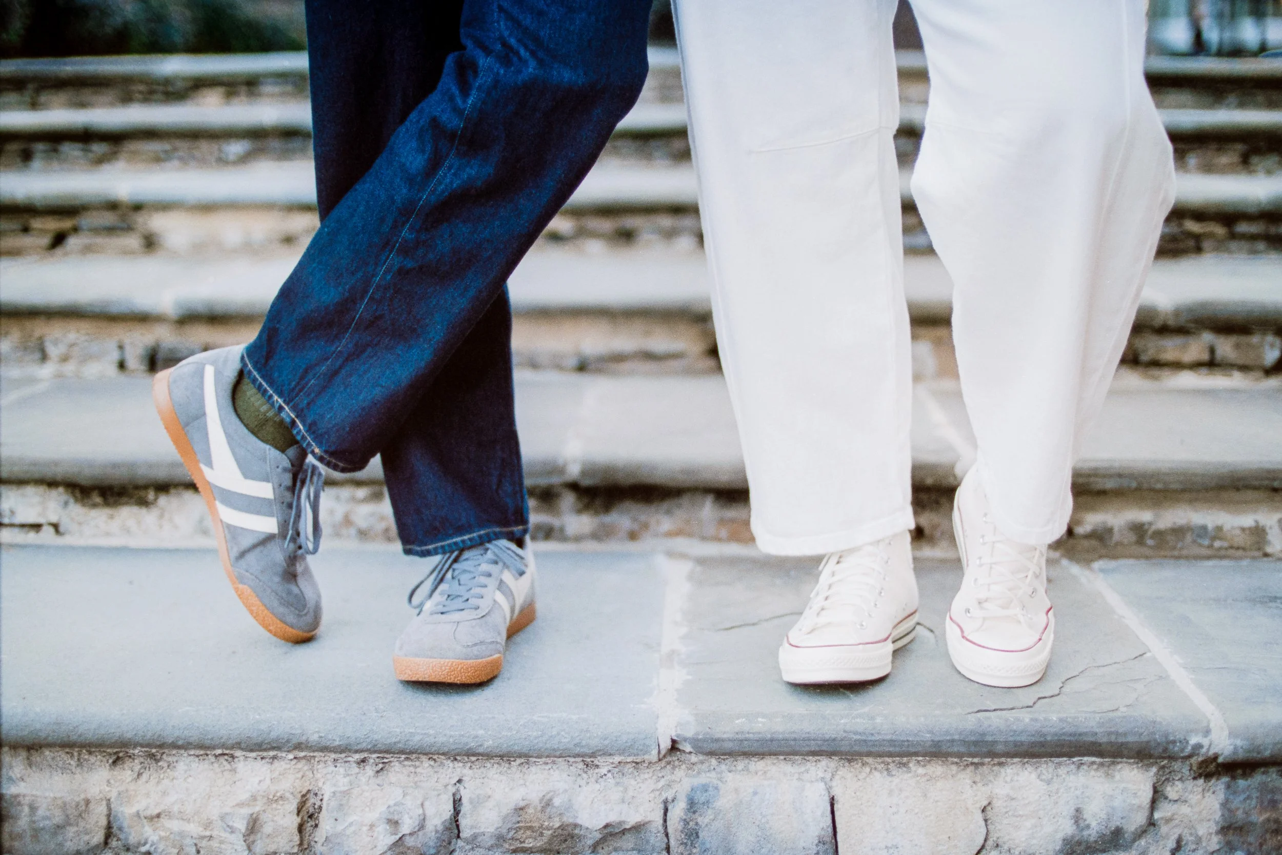 Film Engagement Photos on The Green Uptown Charlotte St Peter Catholic Church by wedding photographer ParksPictures