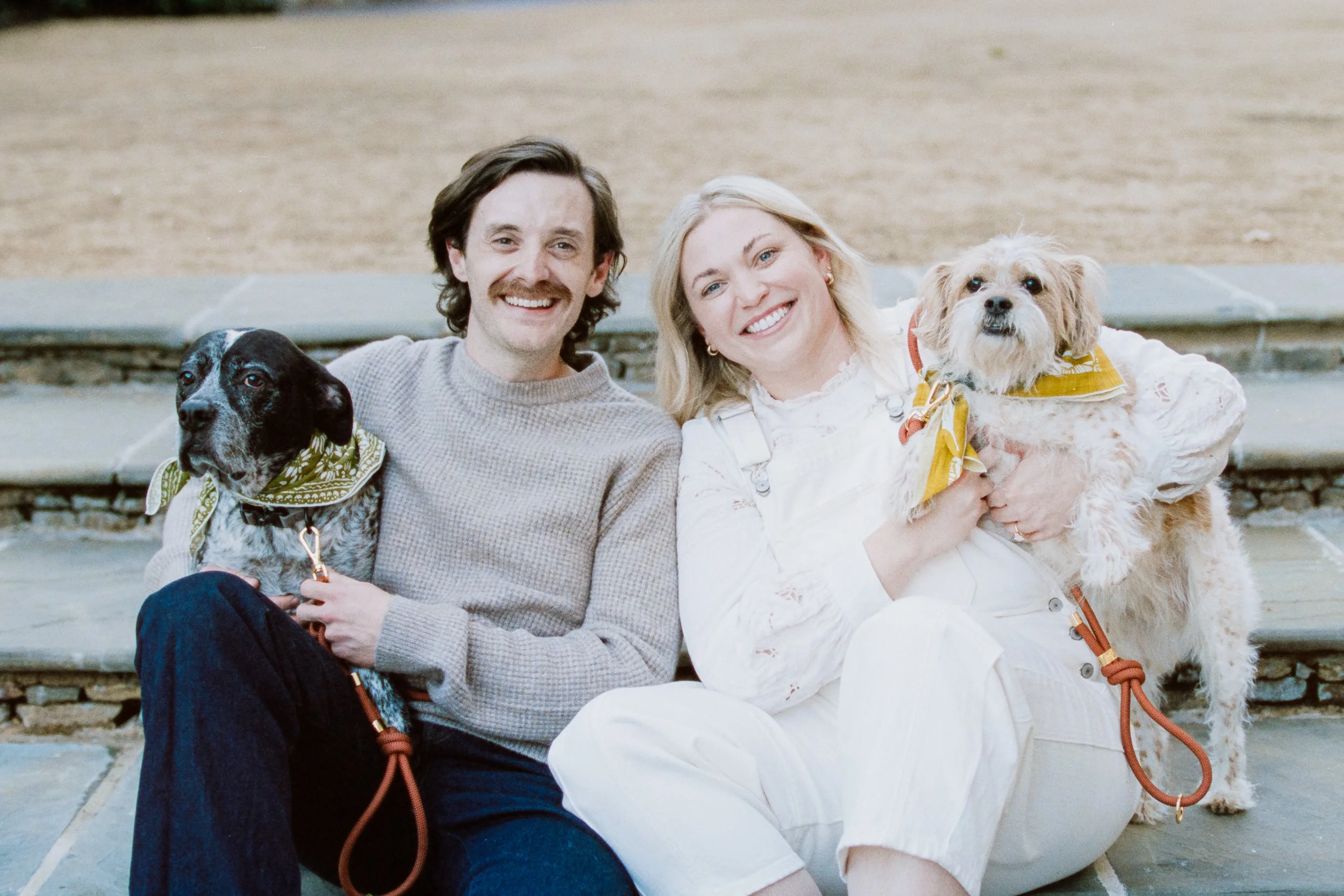 Film Engagement Photos on The Green Uptown Charlotte St Peter Catholic Church by wedding photographer ParksPictures