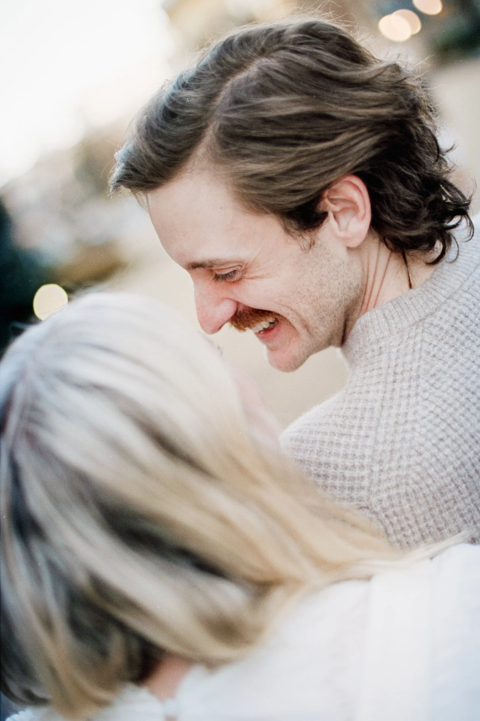 Film Engagement Photos on The Green Uptown Charlotte St Peter Catholic Church by wedding photographer ParksPictures