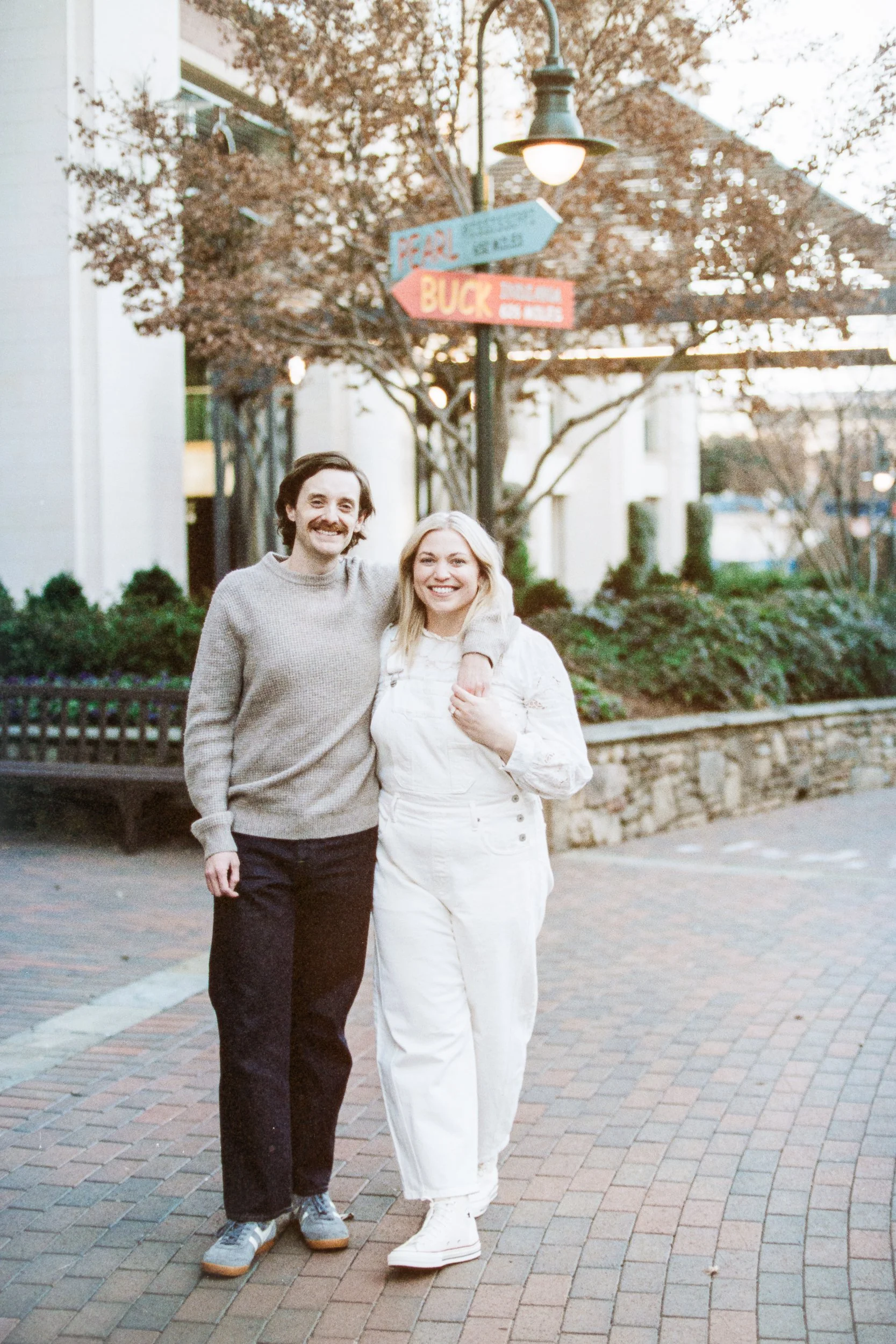 Film Engagement Photos on The Green Uptown Charlotte St Peter Catholic Church by wedding photographer ParksPictures