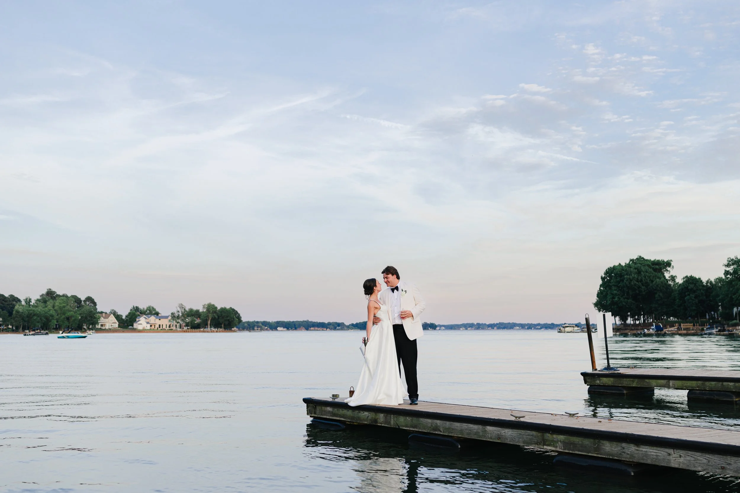 Bride and Groom at sunset on dock Lakeside Wedding on the Function Lawn on film at Trump National Golf Course Charlotte