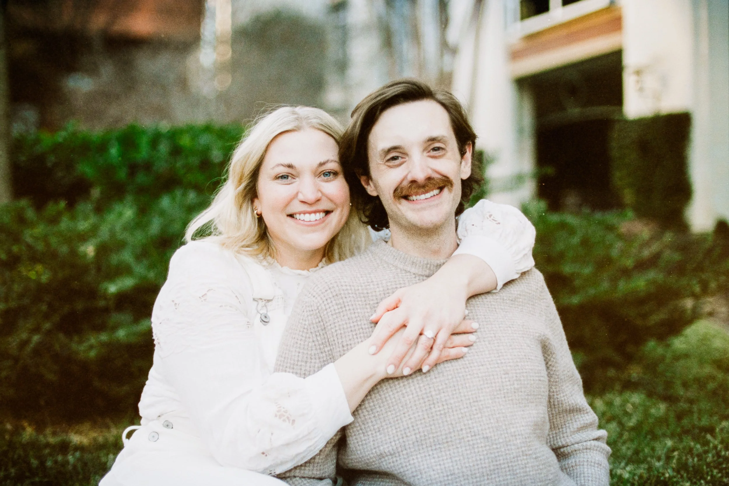 Film Engagement Photos on The Green Uptown Charlotte St Peter Catholic Church by wedding photographer ParksPictures