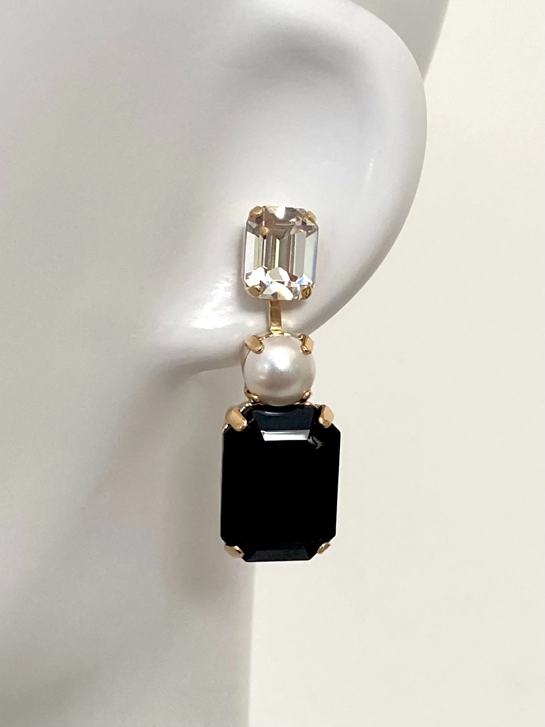 Stones Of Atlantis Kouros Drop Earrings (L) in pearl and jet on head (IMG_7752.jpg)