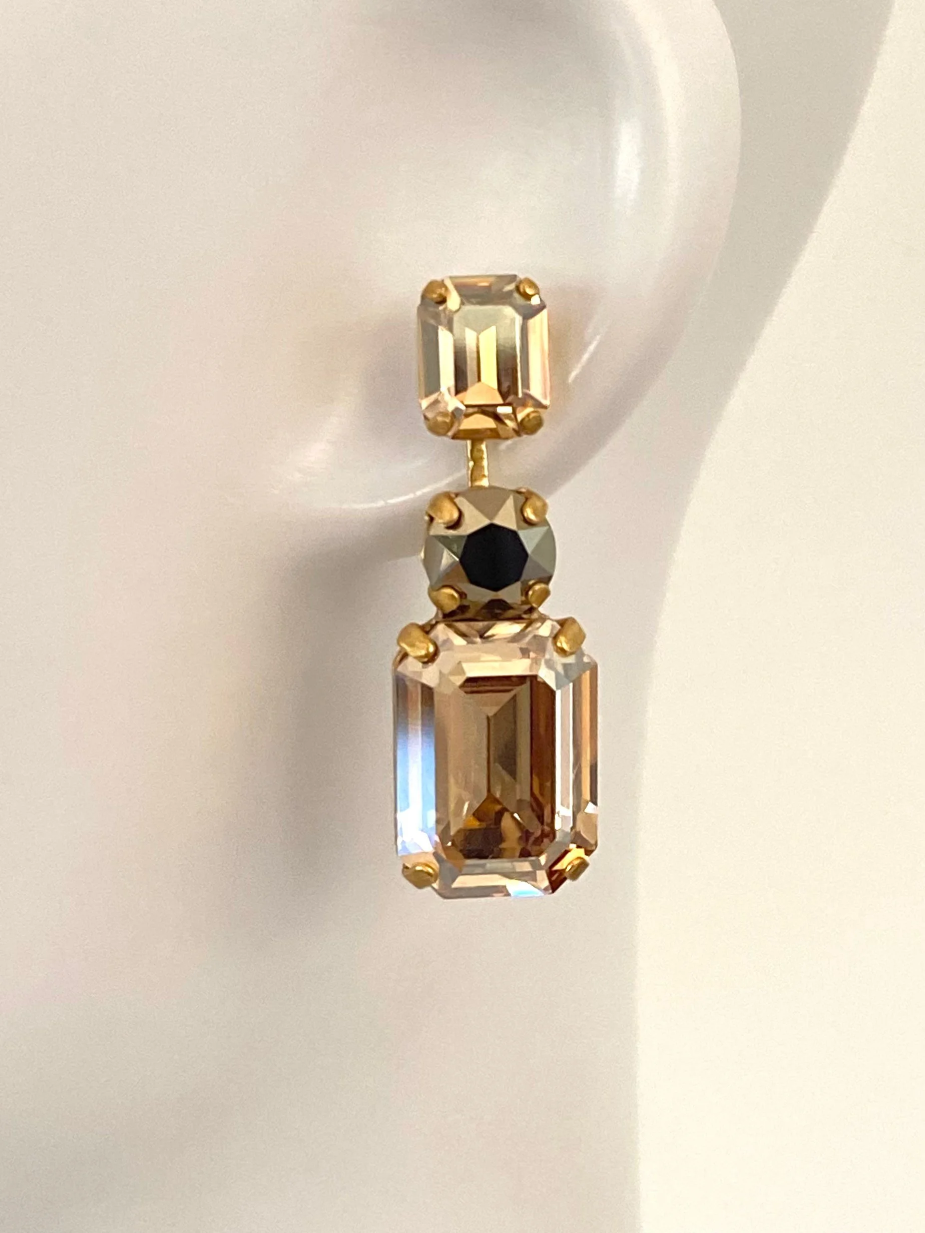 Stones Of Atlantis Kouros Drop Earrings (L) in metallic gold on head