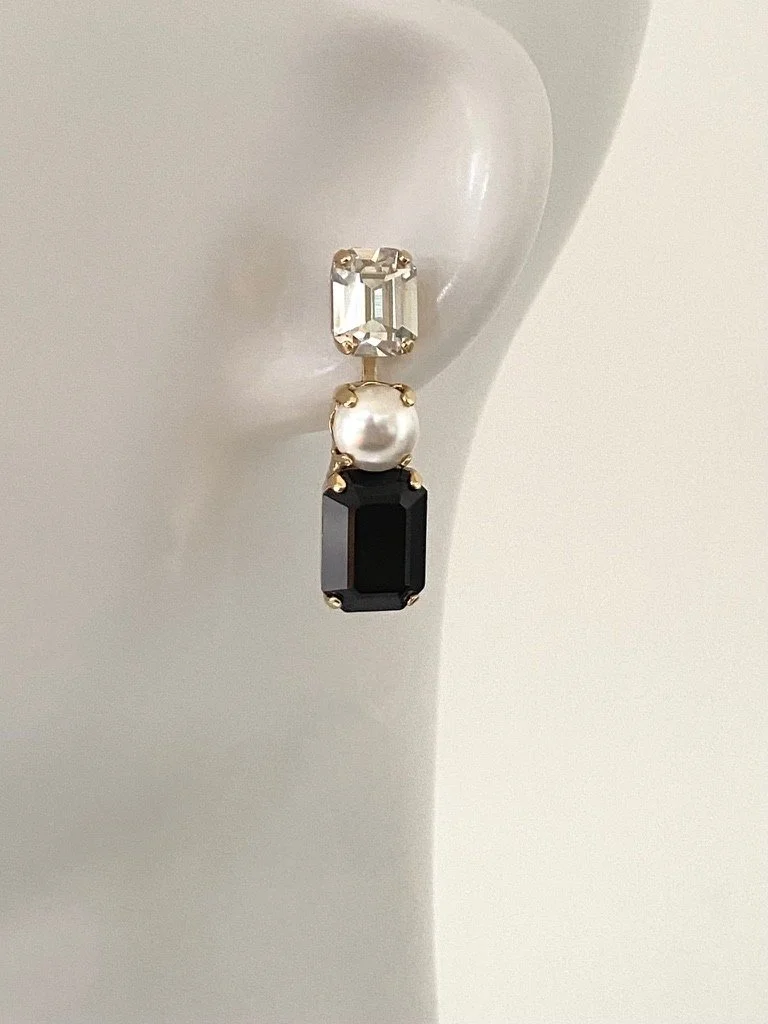 Stones Of Atlantis Kouros Drop Earrings (L) in pearl and jet on head