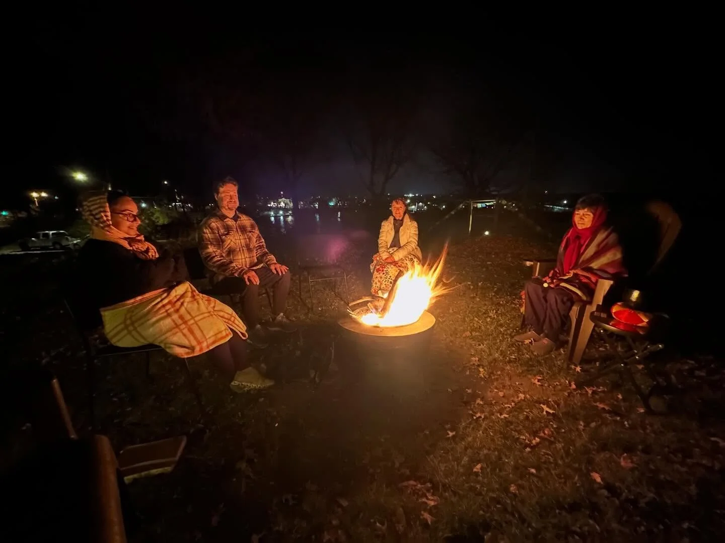 Firelight Practice

Evening settles over the Illinois River, and we gather&mdash;bundled in blankets, warmed by the fire, and held by the quiet rhythm of practice.
Nothing to force, nothing to fix. Just breath, warmth, and the gentle reminder that aw