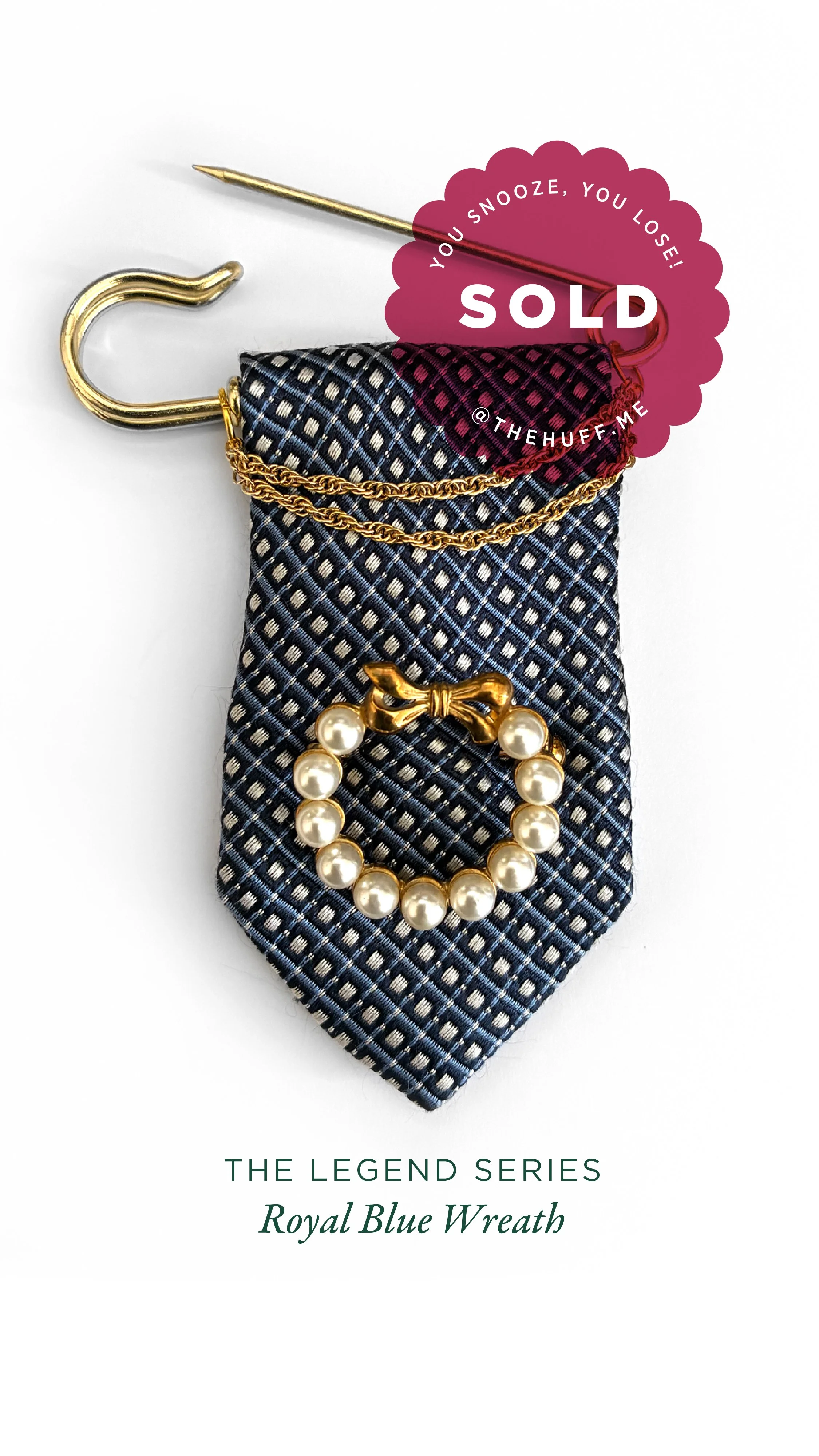 A jewelry display featuring a pearl bracelet with a golden bow, a gold chain, and a brooch on a blue patterned fabric background, with a pink sale sticker that reads 'You snooze, you lose! SOLD'