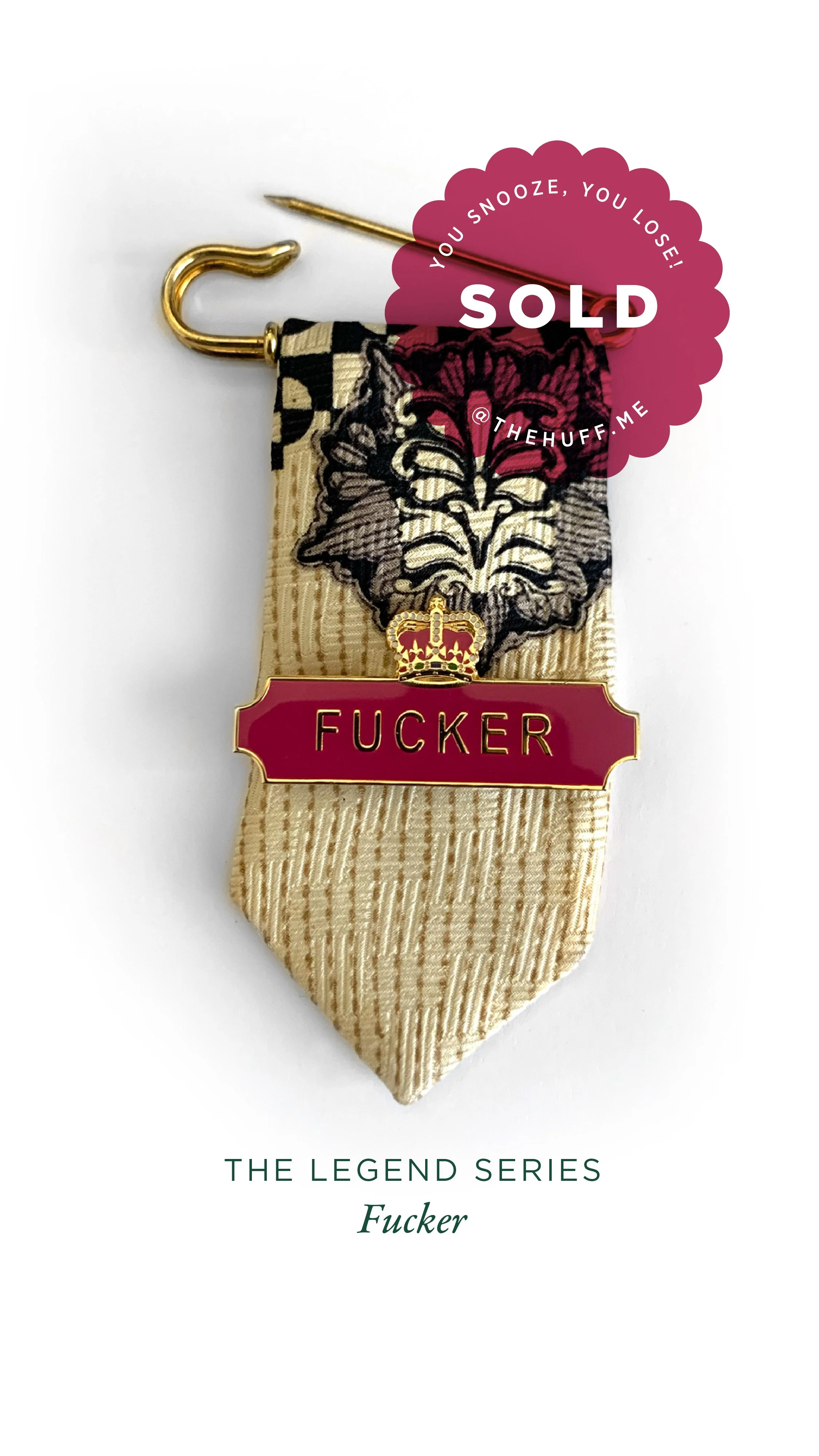 A medal featuring an intricate pattern with a red and gold badge that says 'FUCKER'. A pink sticker says 'SOLD' with the text 'You snooze, you lose!' and '@thehuff.me'.