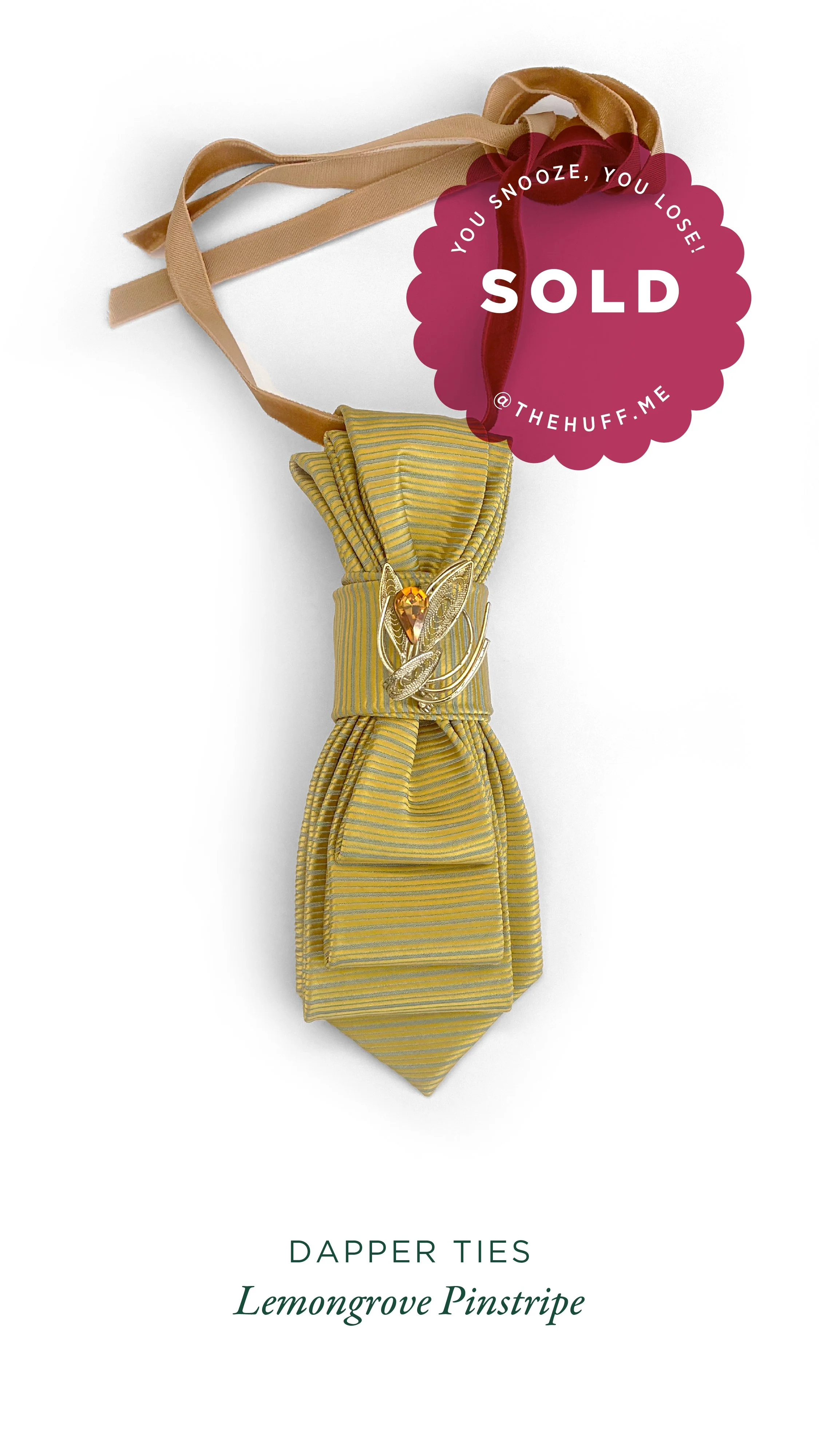 Yellow and grey striped dapper tie with lemon grove pinstripe pattern with a decorative gold butterfly brooch and a beige ribbon, marked as sold.