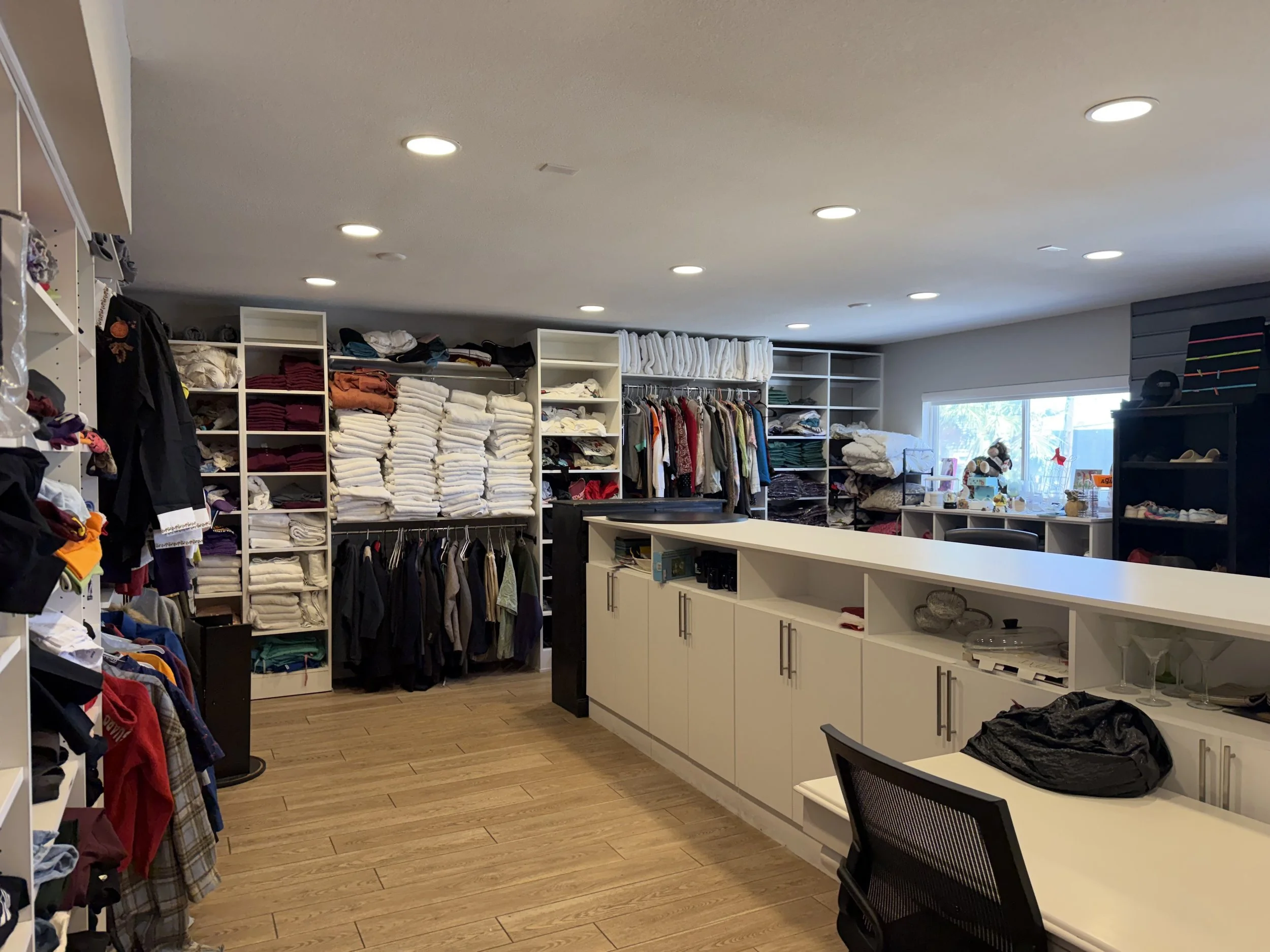 A room of shelves with clothes