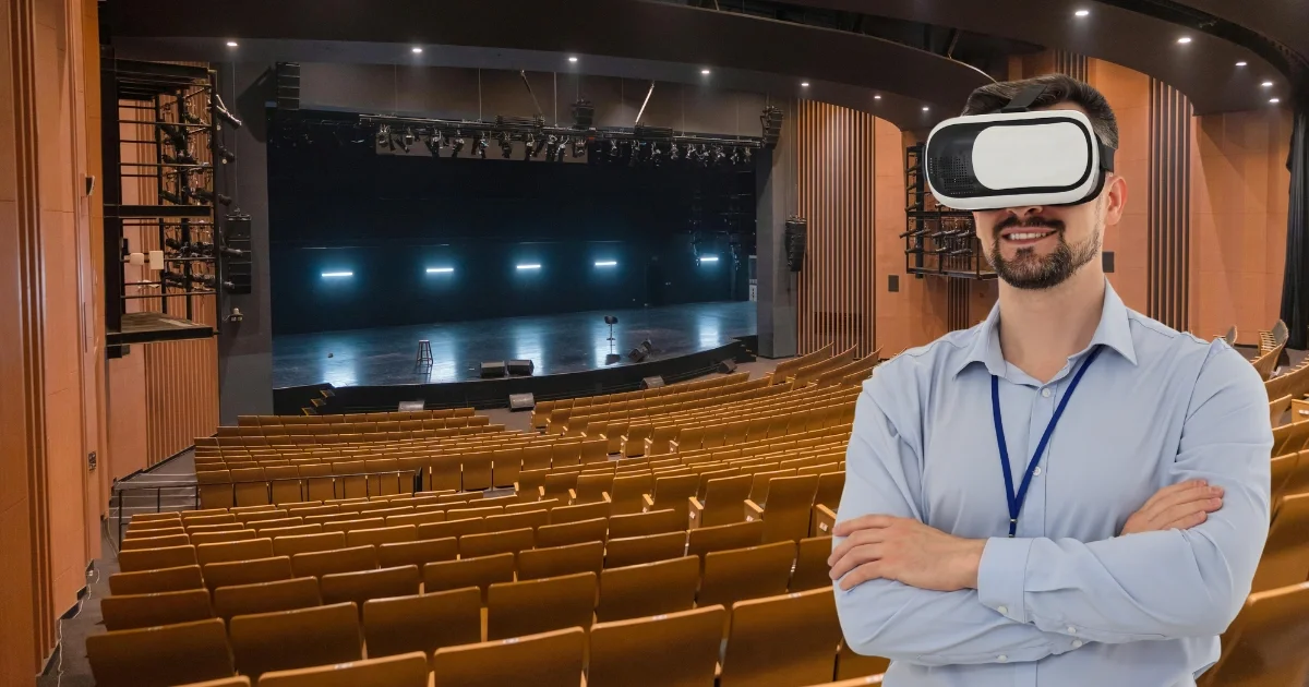 Venue manager using VR headset inside theater for event space virtual tour services