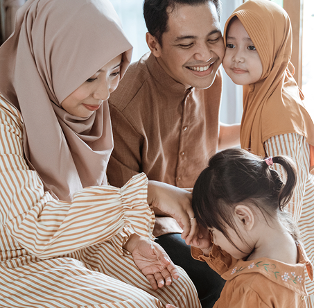 Family spending quality time together during hospice care , smiling and interacting with each other indoors.