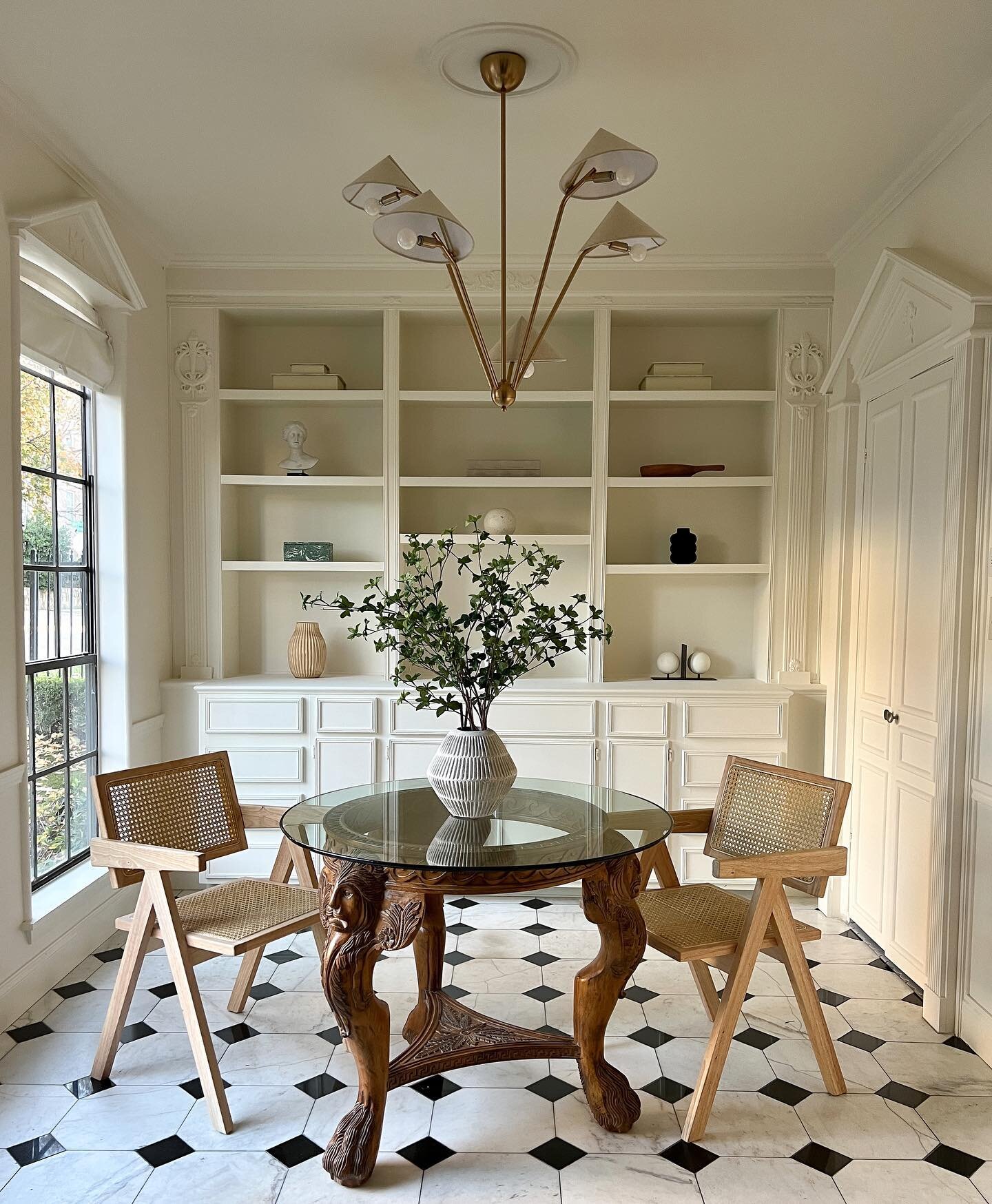 The dining space for two at Artistic Abode featuring a unique piece &mdash; a beautifully crafted mahogany claw foot dining table adorned with the heads of a lion
.
.
.
.
.
.
.
.
.
.
.
.

#interiordesign #neutralaesthetic #pierrejeanneret #midcentury