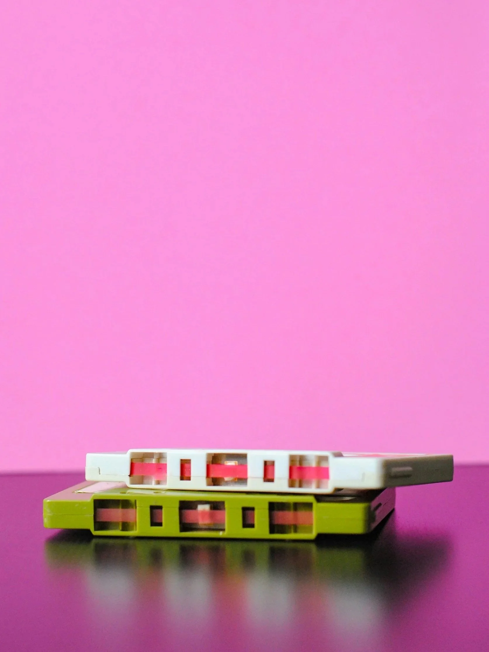 pink background and cassette tapes