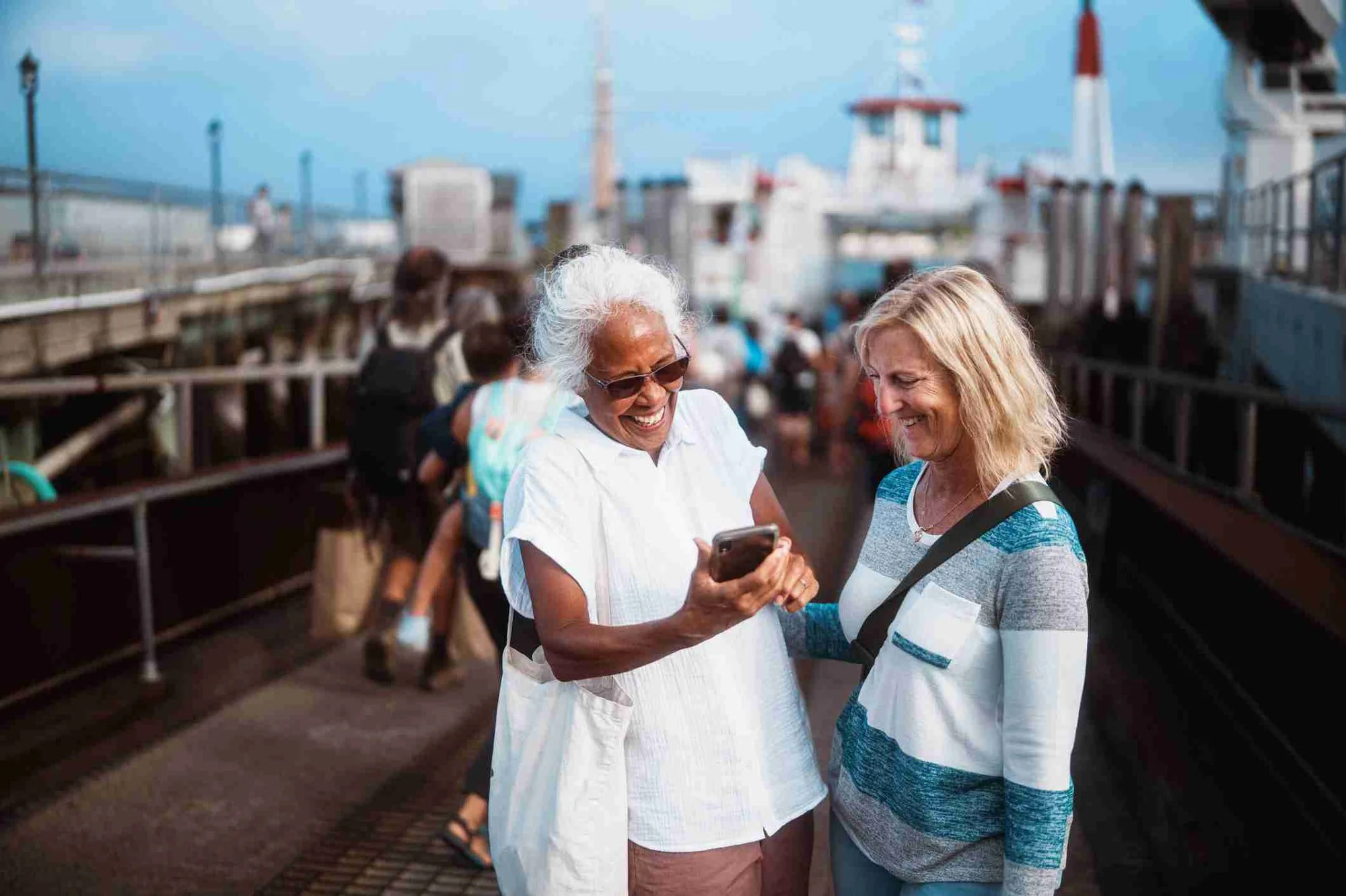 : Two senior women are discussing about best sports in Portland, OR