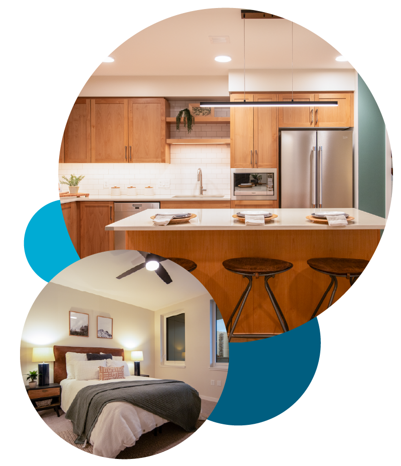 A split view of an interior kitchen and bedroom. The kitchen features wooden cabinets, a refrigerator, a sink, and a central island with bar stools. The bedroom includes a bed with pillows, side tables, lamps, and wall art.